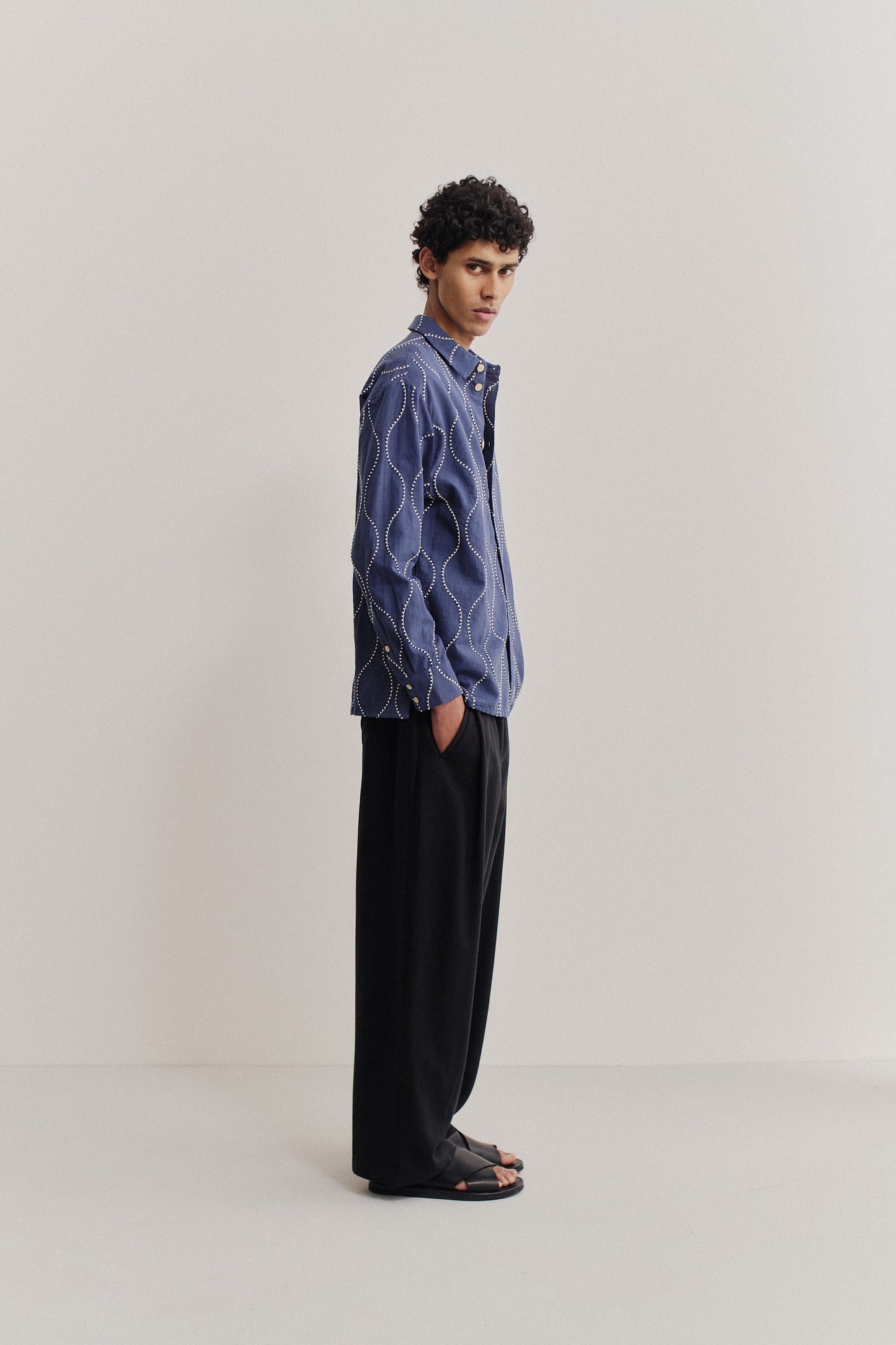Men's long-sleeved shirt, cotton, embroidered wavy pattern, blue with white stitching.