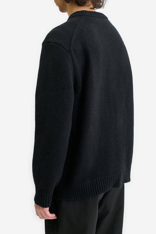 Men's knit pullover, black wool-cashmere blend, relaxed fit, rib-knit details.