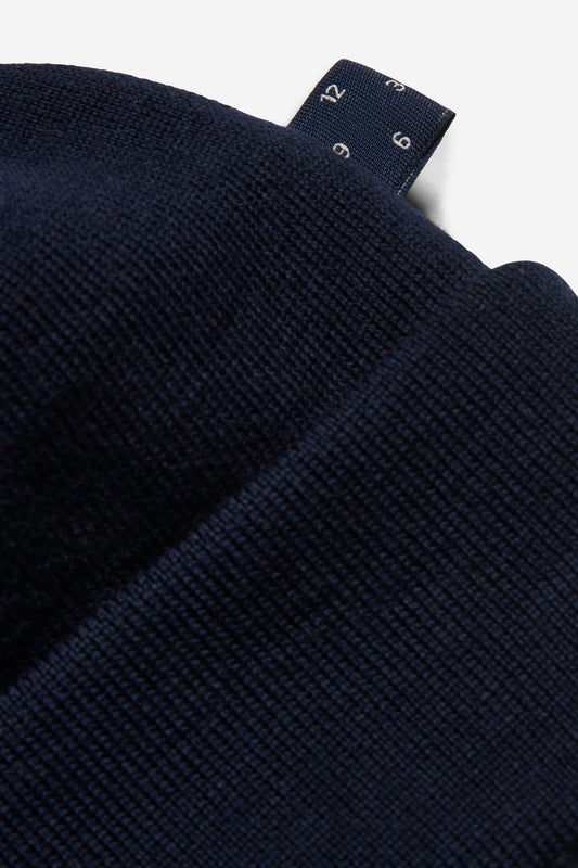 Unisex accessories beanie, 100% mulesing-free merino wool, navy, with a visible brand tag.