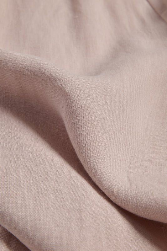 Pillowcase, 100% Belgian linen, apple blossom color, 80x80cm, with subtle fabric texture.
