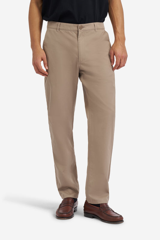Men's long-pants, organic cotton twill, washed beige, with flat front and button-up back pockets.
