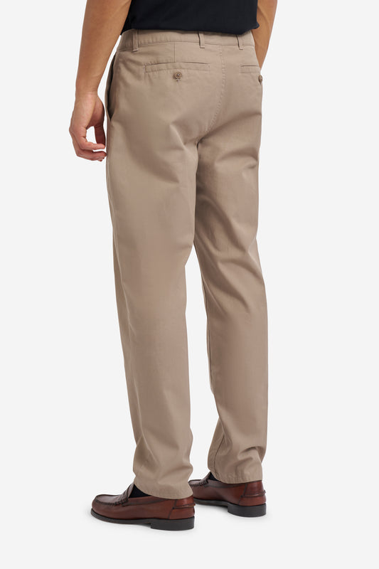 Men's long-pants, organic cotton twill, washed beige, with button-up box back pockets.