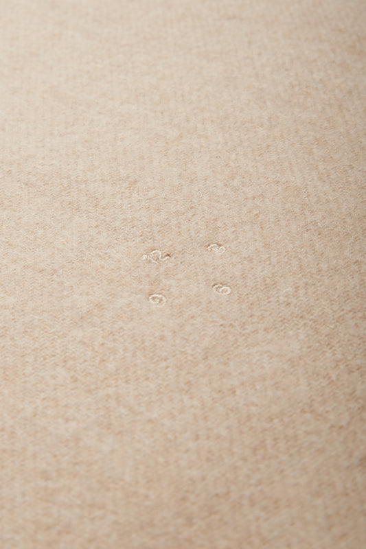Women's accessories cashmere scarf, creme, with subtle embroidered details.