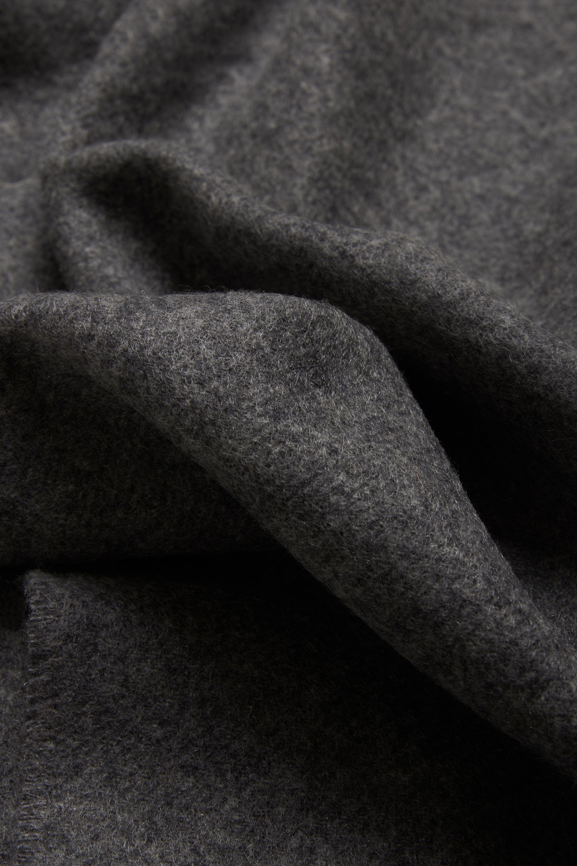 Women's accessories cashmere scarf, grey melange, soft texture, folded.