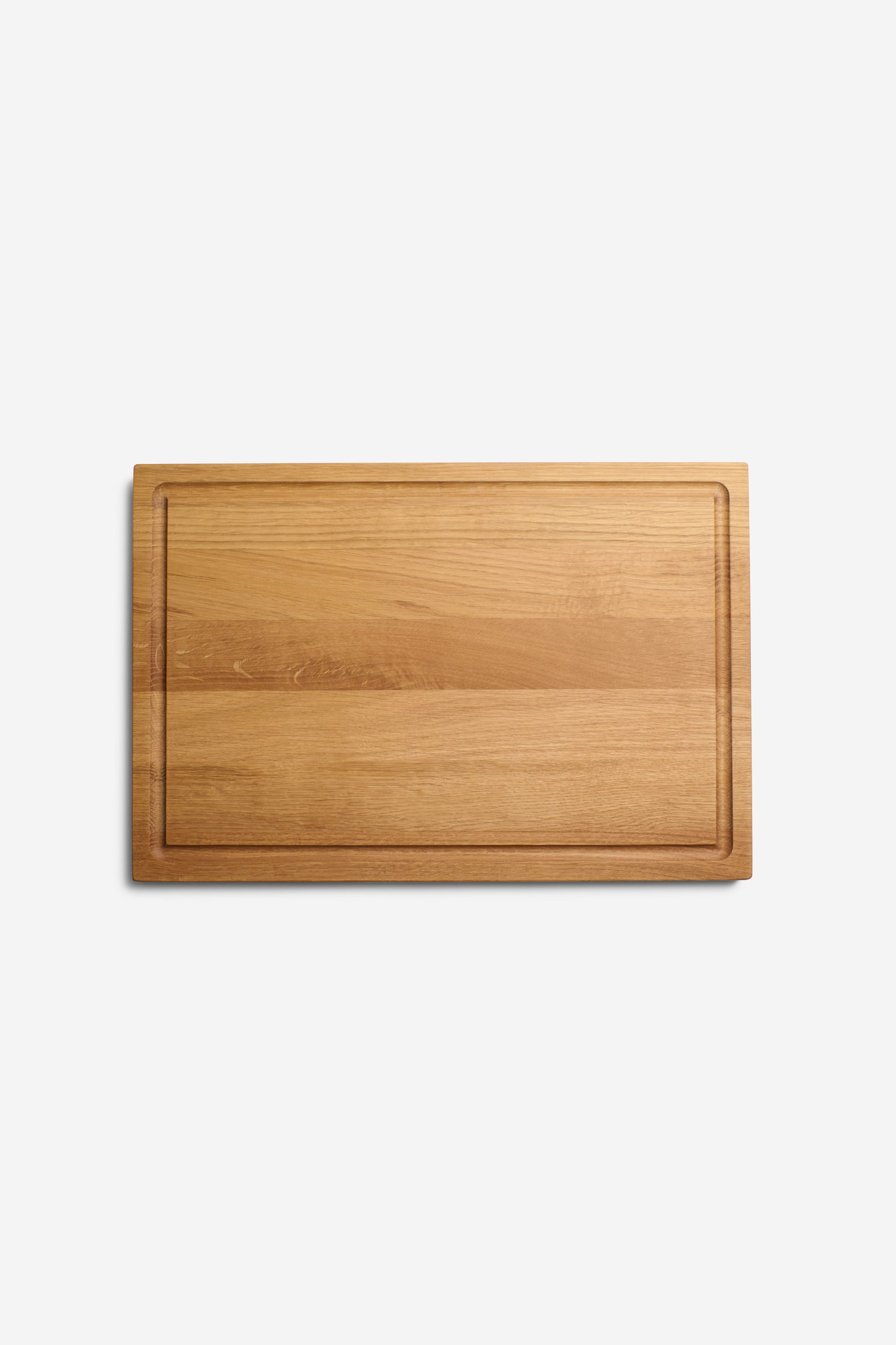 Rectangular oak chopping board with juice groove, handcrafted in Germany.