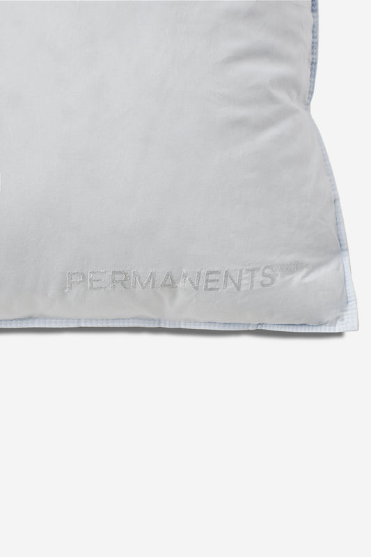 White Eiderdown Pillow with embroidered "PERMANENTS" logo and light blue piped edges.