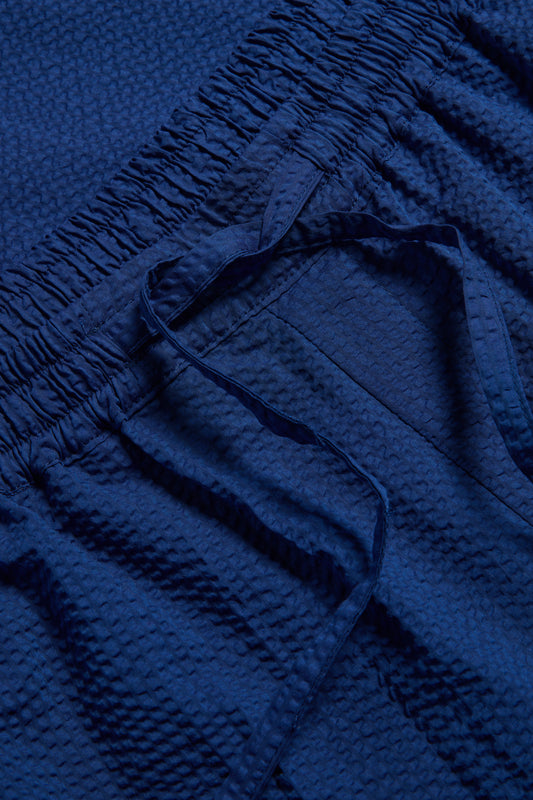 Unisex pyjama pants, organic cotton seersucker, blue hour, with elasticated drawstring waist.