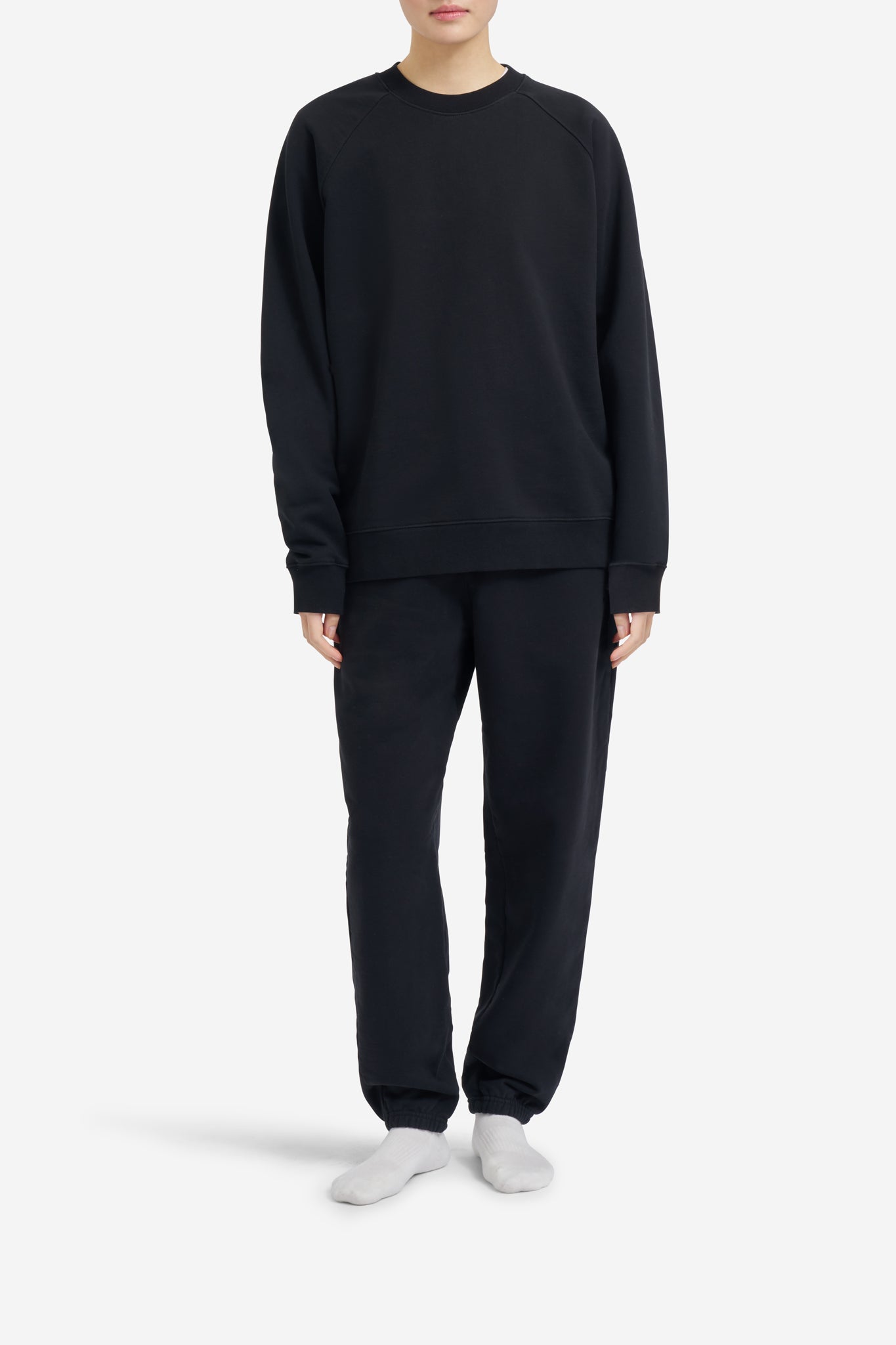 Women's knit jersey, pre-washed organic cotton raglan sweater in black.