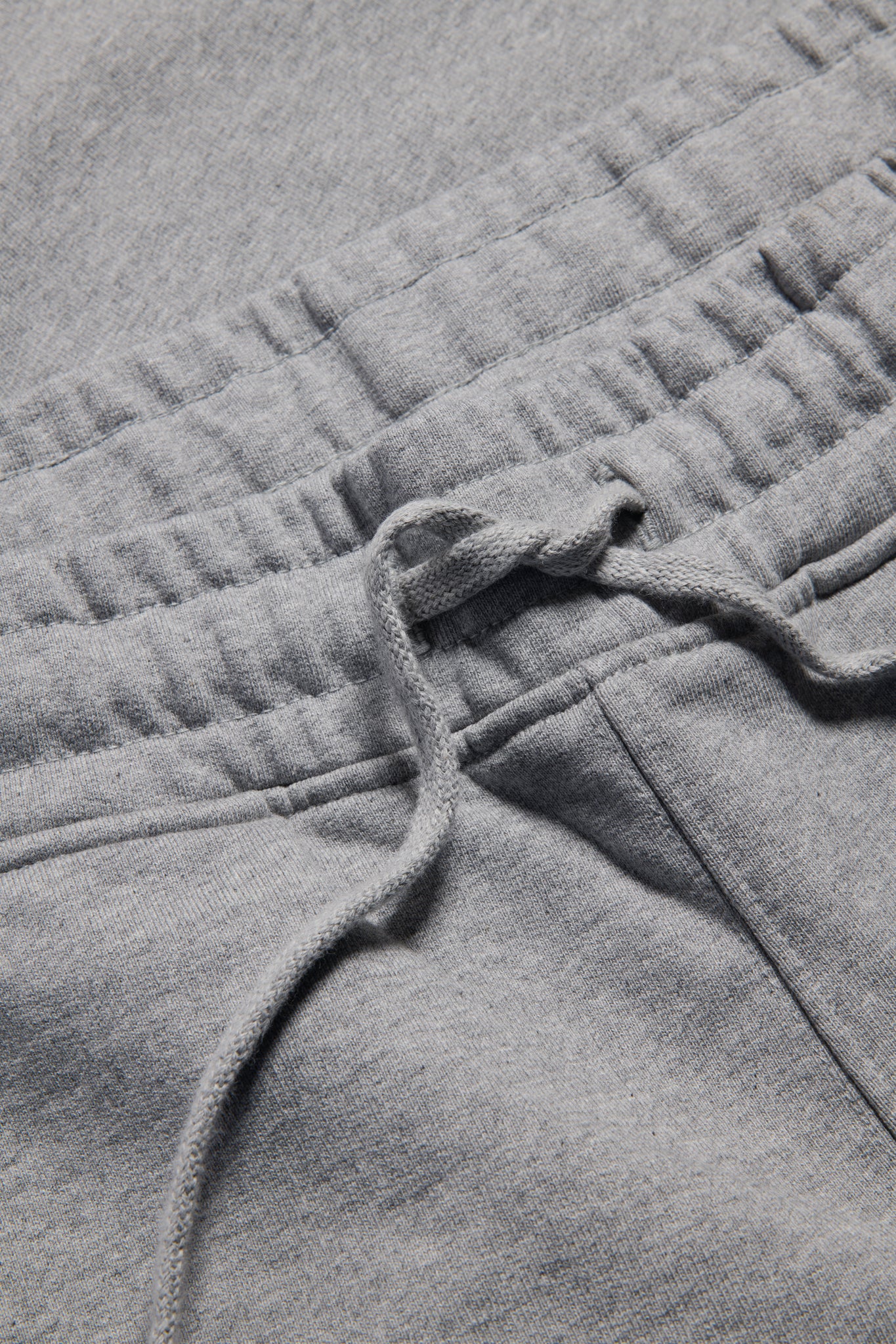 Unisex jersey long-pants, organic cotton, grey melange, with elastic waistband and drawstring.