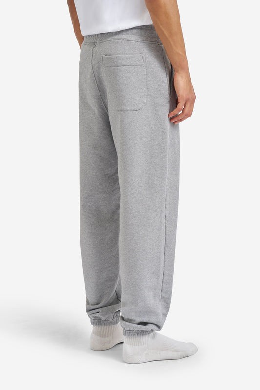 Men's long-pants, organic cotton jersey, grey melange, with back pocket and elastic cuffs.