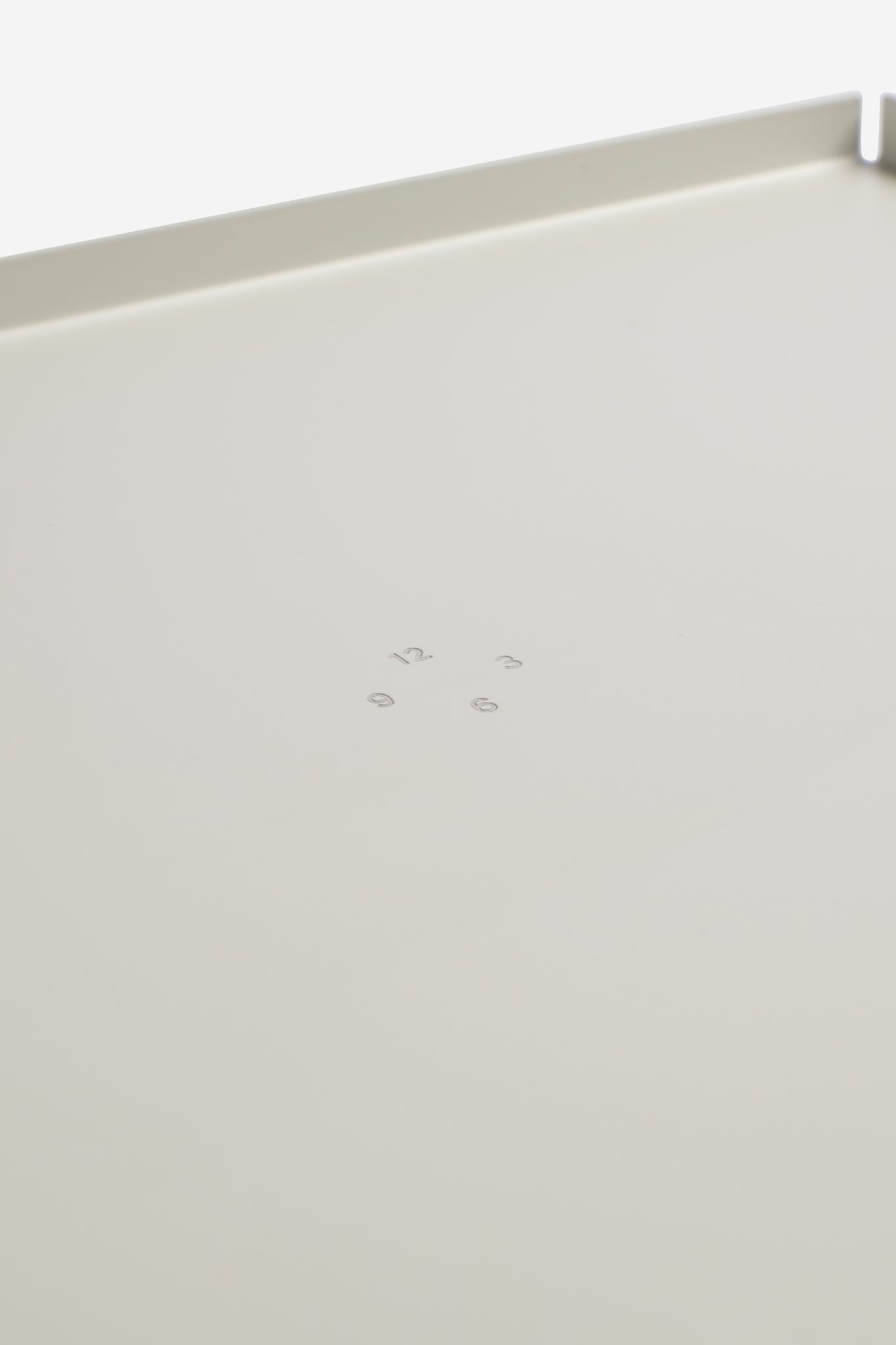 White coated aluminum tray, 34x26cm, with subtle embossed numbers.