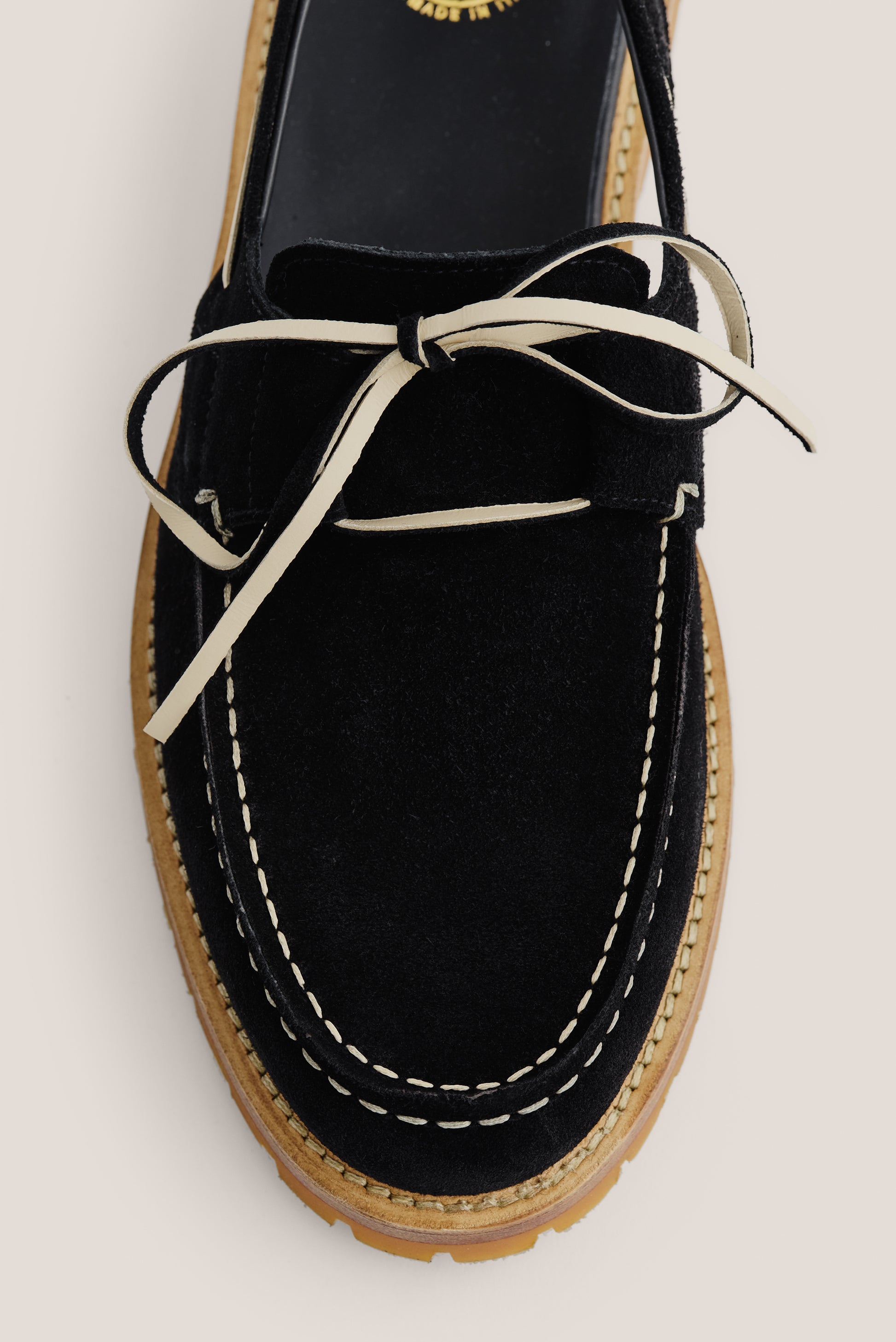 Men's accessories sandal, black Italian vegetal cowhide, boat-style with white lacing and stitching.