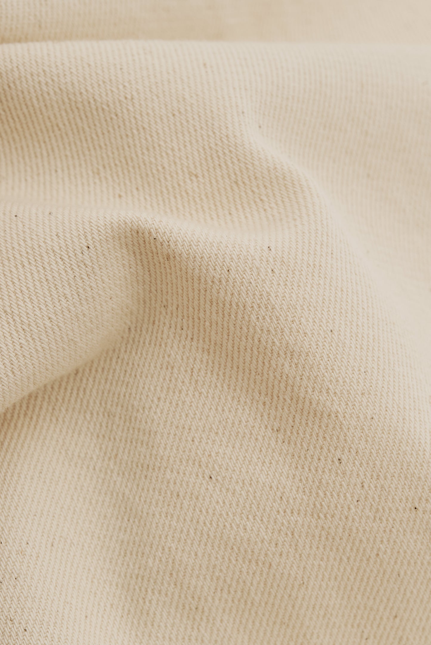 Men's long-pants, organic cotton raw denim, pre-washed, off-white.