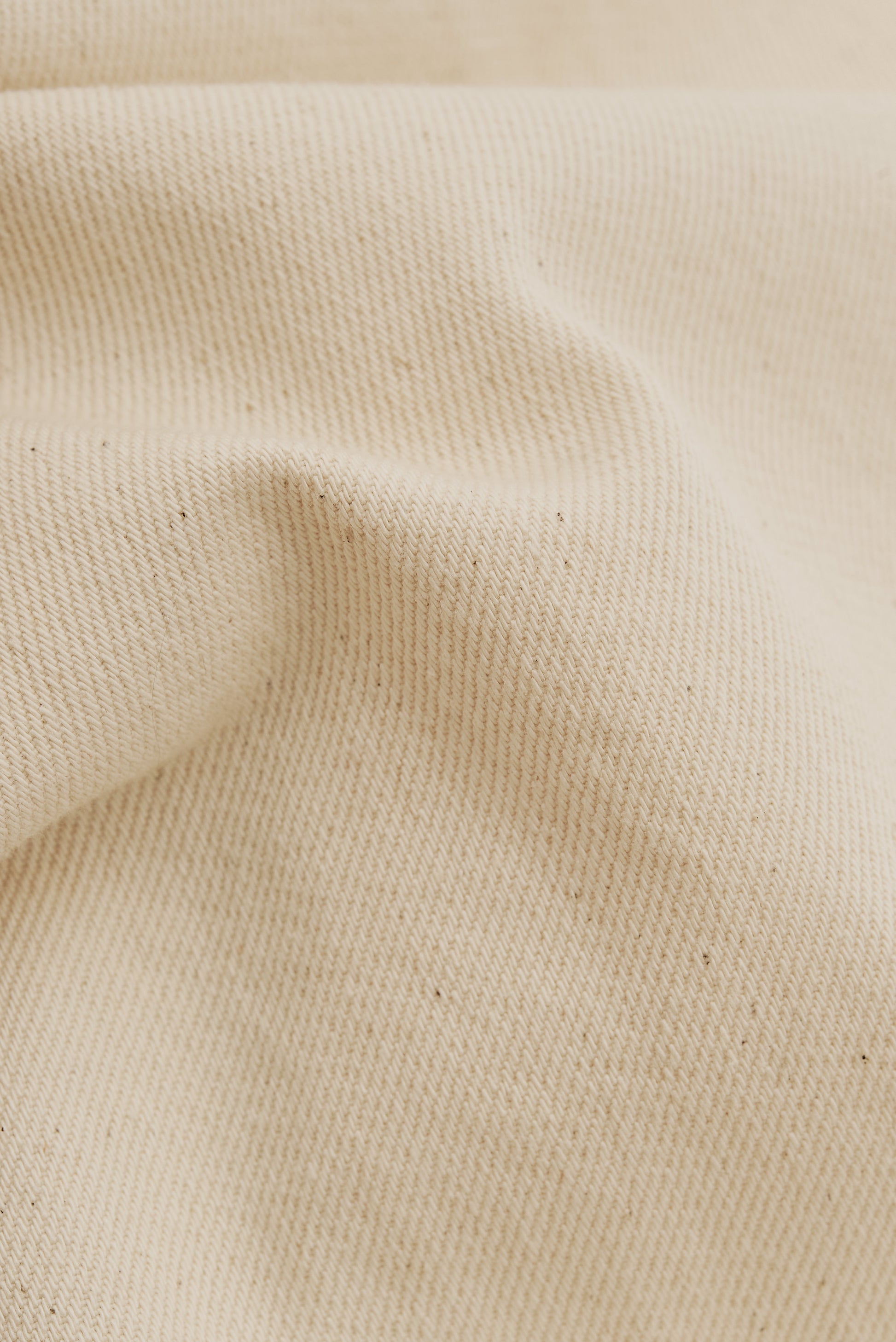 Men's long-pants, organic cotton raw denim, pre-washed, off-white.