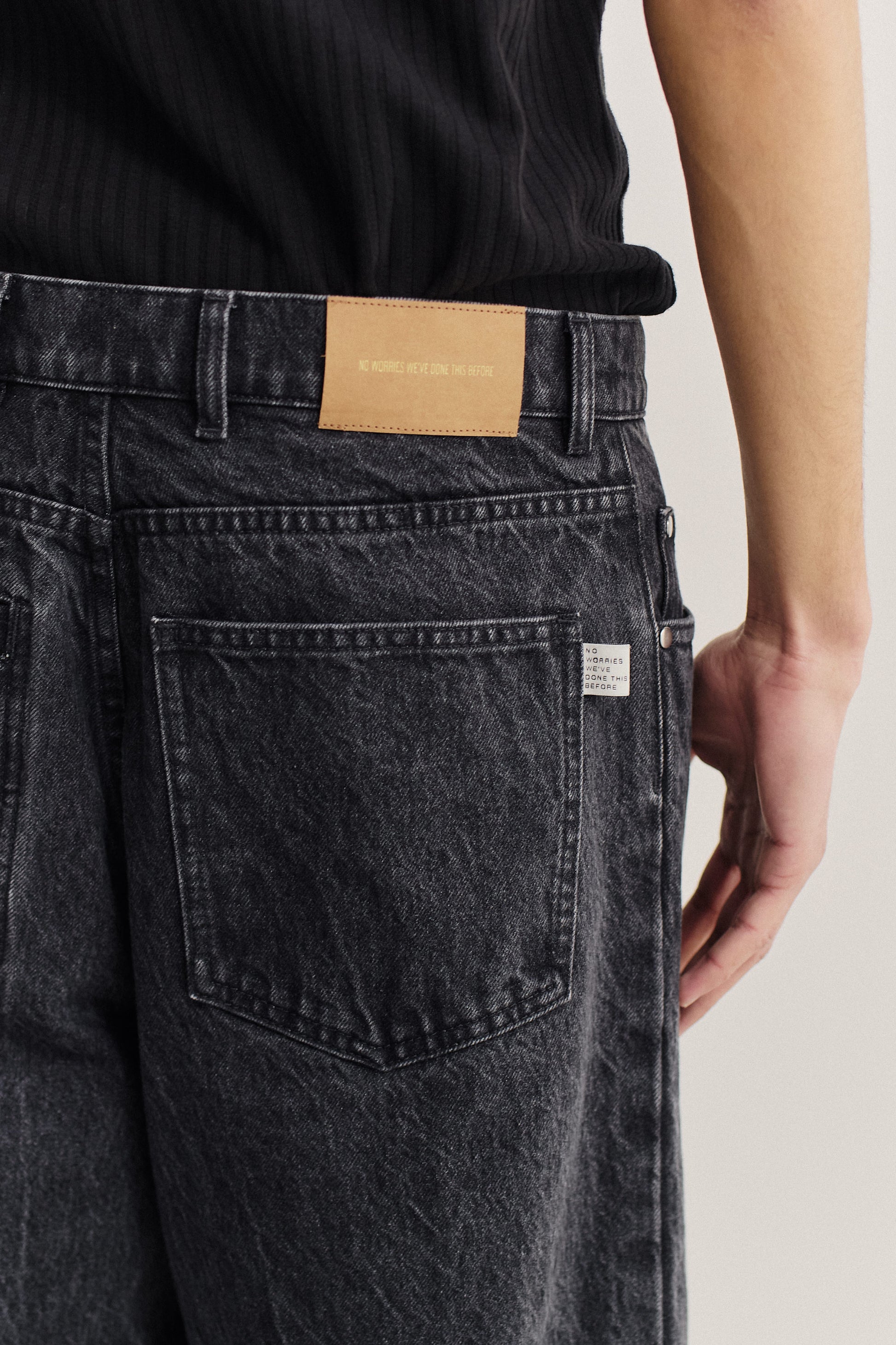 Men's long-pants, organic cotton denim, stone wash, dark grey, with pleated detail and classic 5-pocket design.