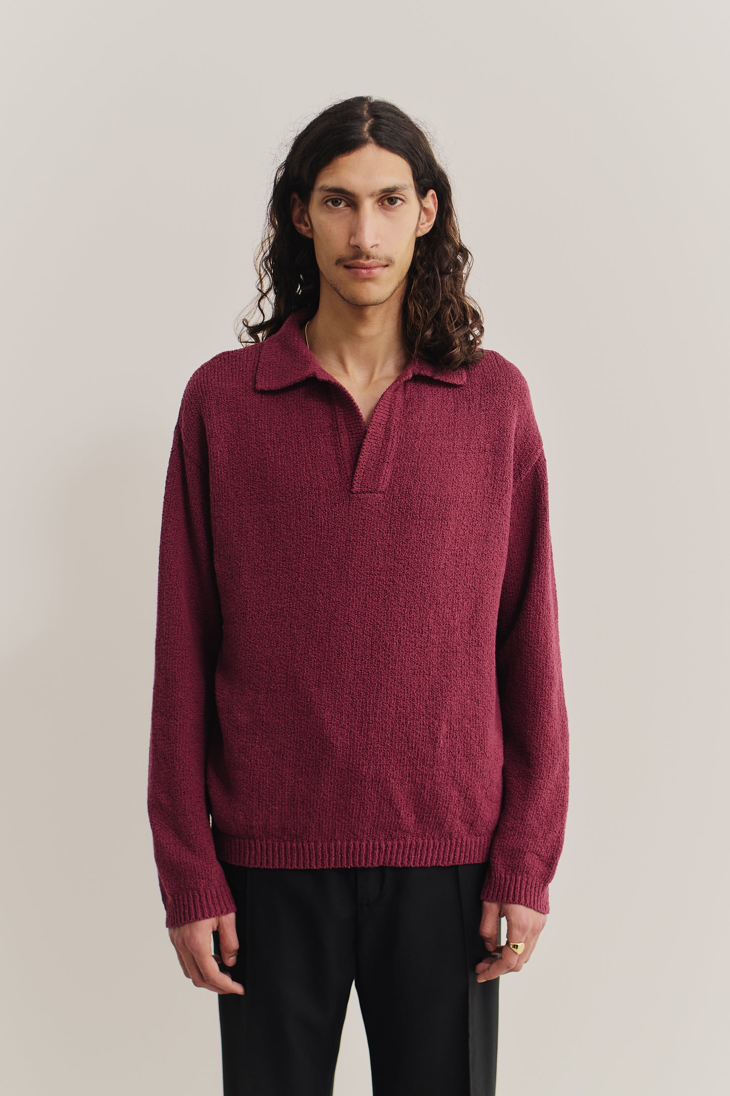 Men's knit long-sleeved polo, 100% organic cotton bouclé, deep red, relaxed fit with open collar.