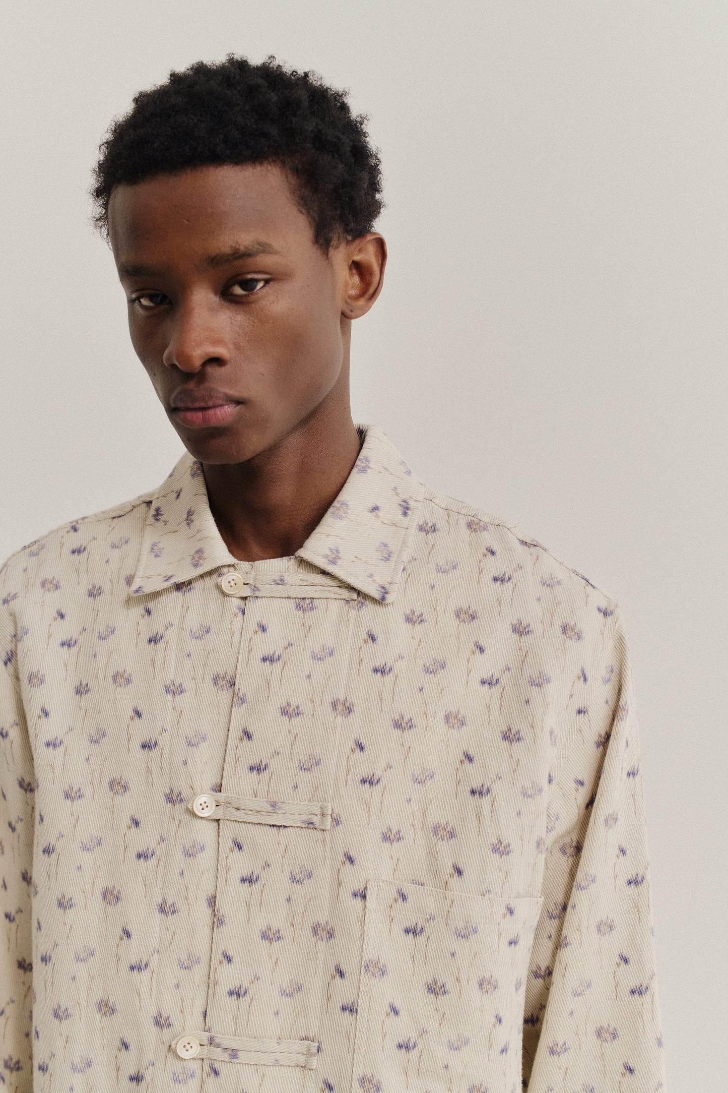 Men's long-sleeved shirt, cotton-linen blend twill, ecru with subtle lilac floral print, front patch pocket.