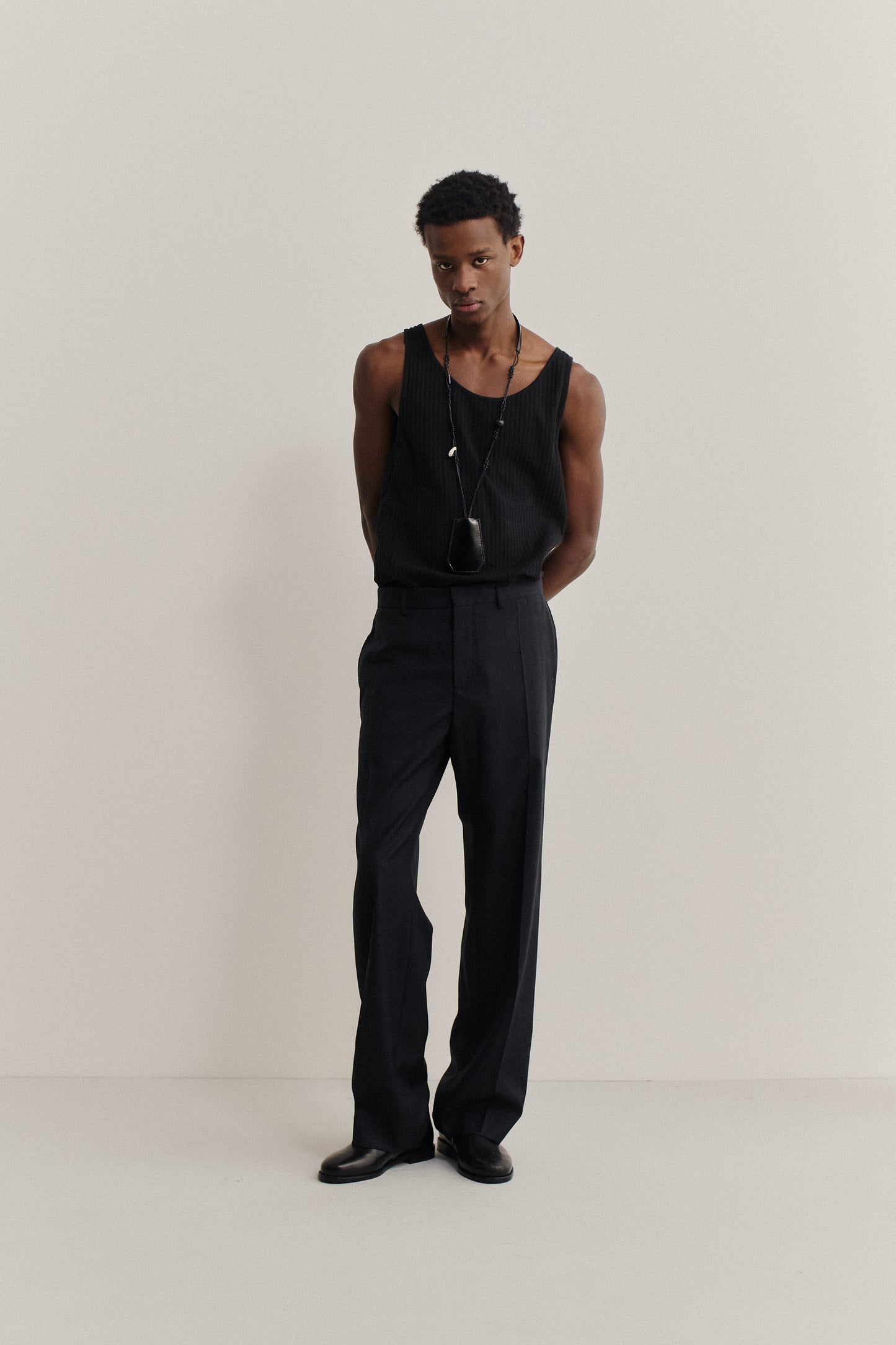 Men's long-pants, tailored wide-leg virgin wool, subtle checkered pattern, black.