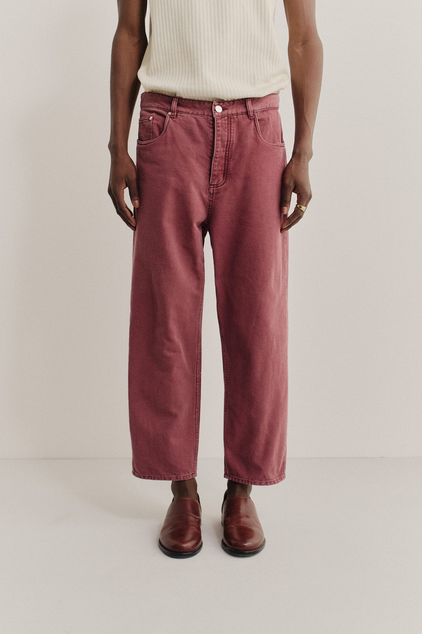 Men's long-pants, organic cotton, stone washed, red Terek Jeans with a loose fit and cropped length.