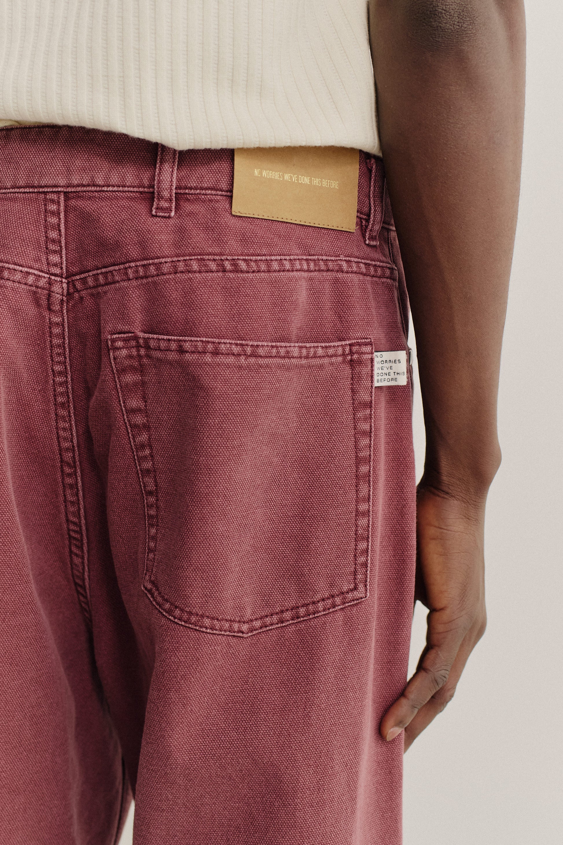 Men's long-pants, organic cotton, stone washed, burgundy Terek Jeans with a loose, tapered fit.