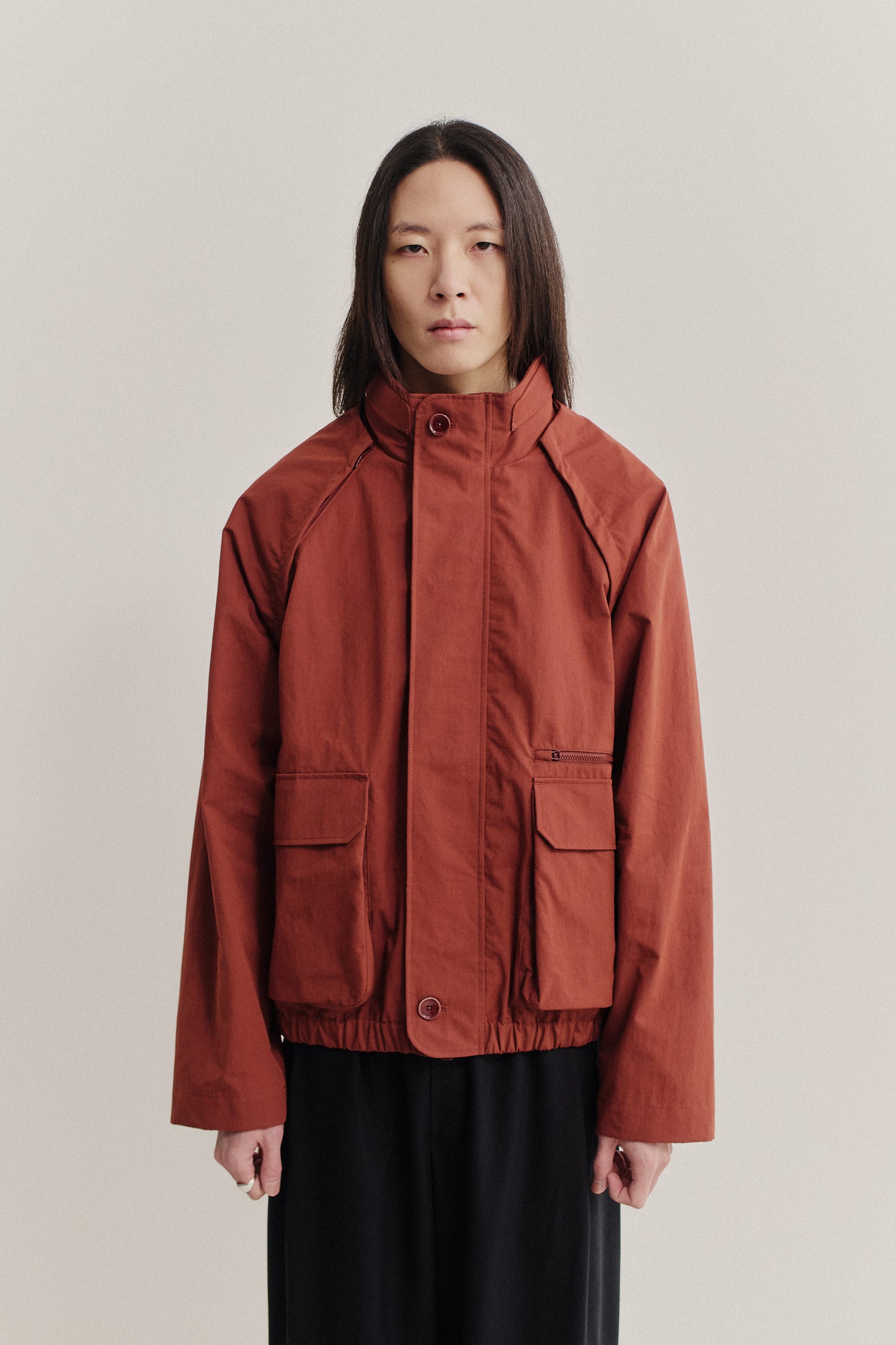Men's outerwear, Zambezi Fisher Jacket in terracotta cotton blend, wide silhouette, deep raglan sleeves, bellows pockets.
