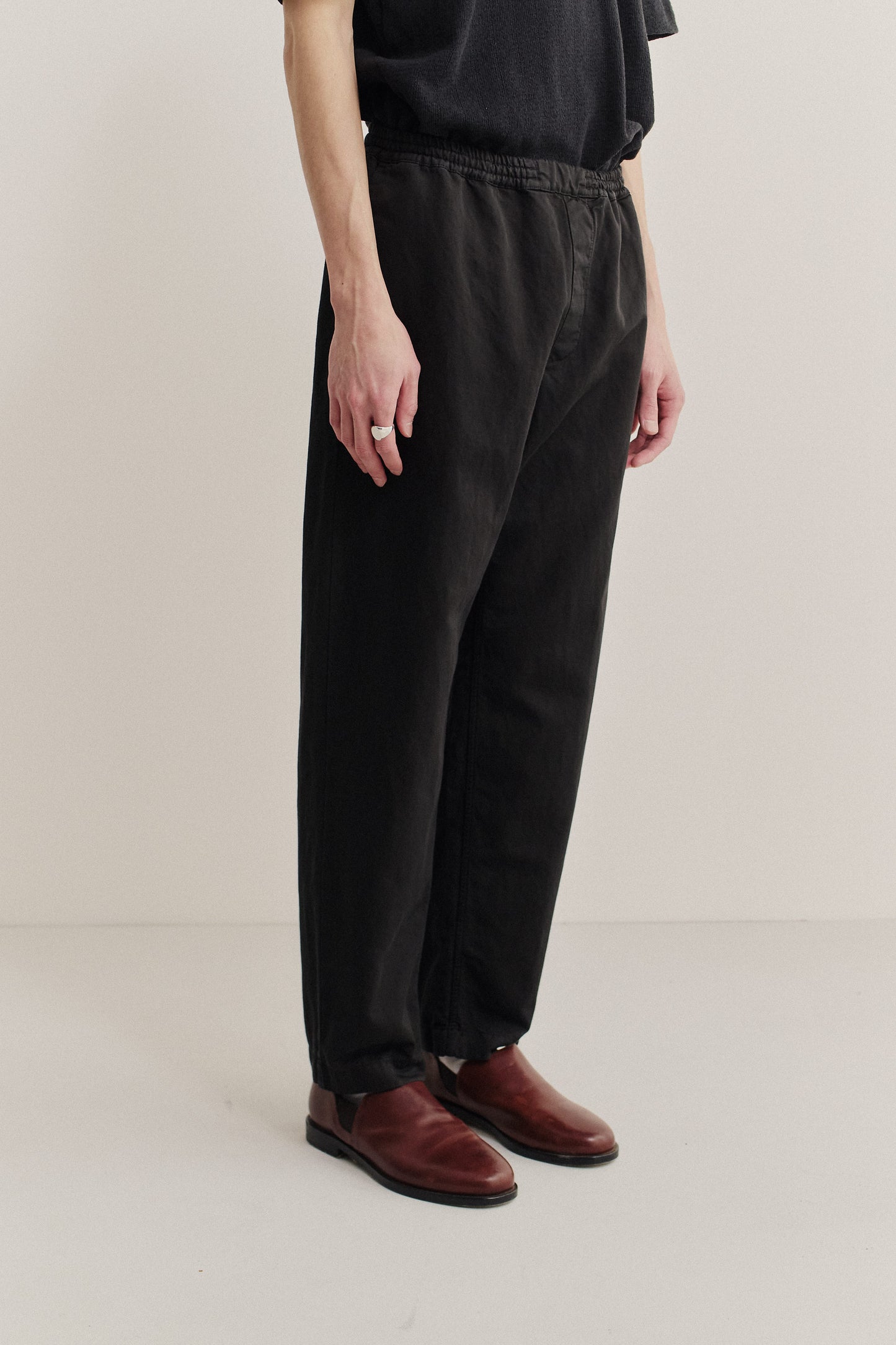 Men's long-pants, linen-cotton blend, garment-dyed black, relaxed fit, elastic waist, cropped leg.
