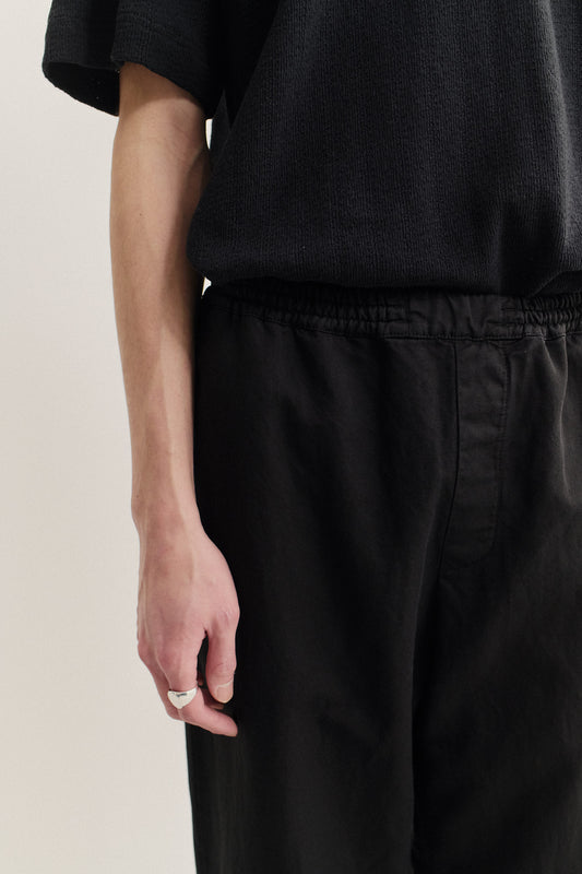 Men's long-pants, linen-cotton blend, garment-dyed black, with elasticated waistband.