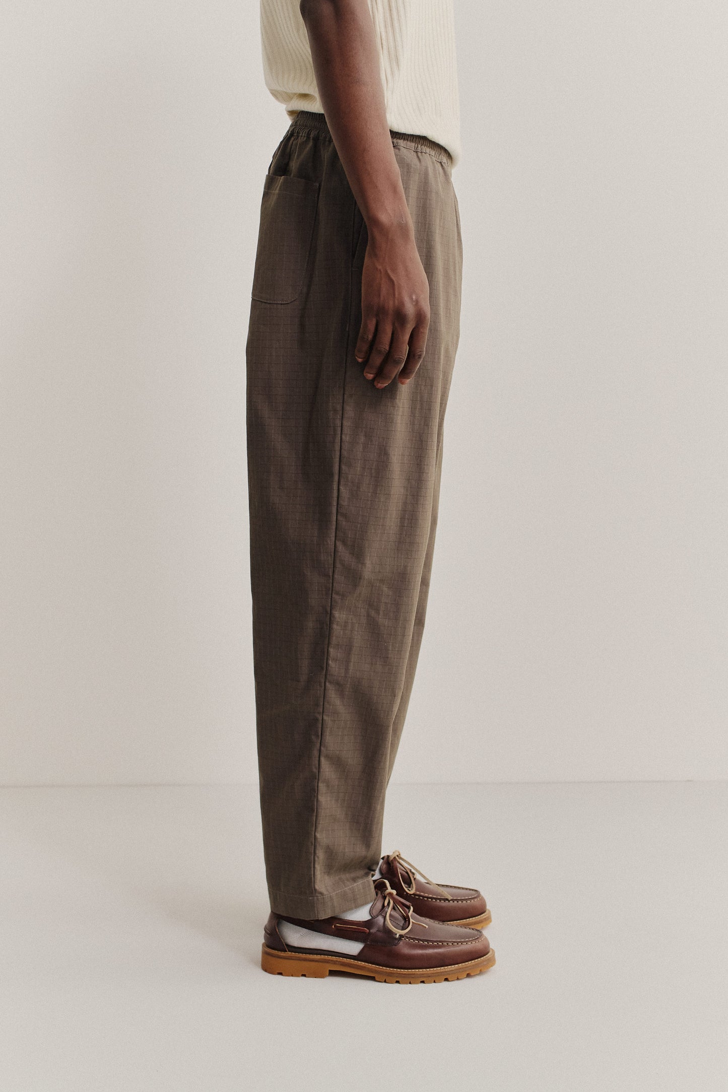 Men's long-pants, cotton blend ripstop, brown, relaxed fit with elastic waist and cropped leg.