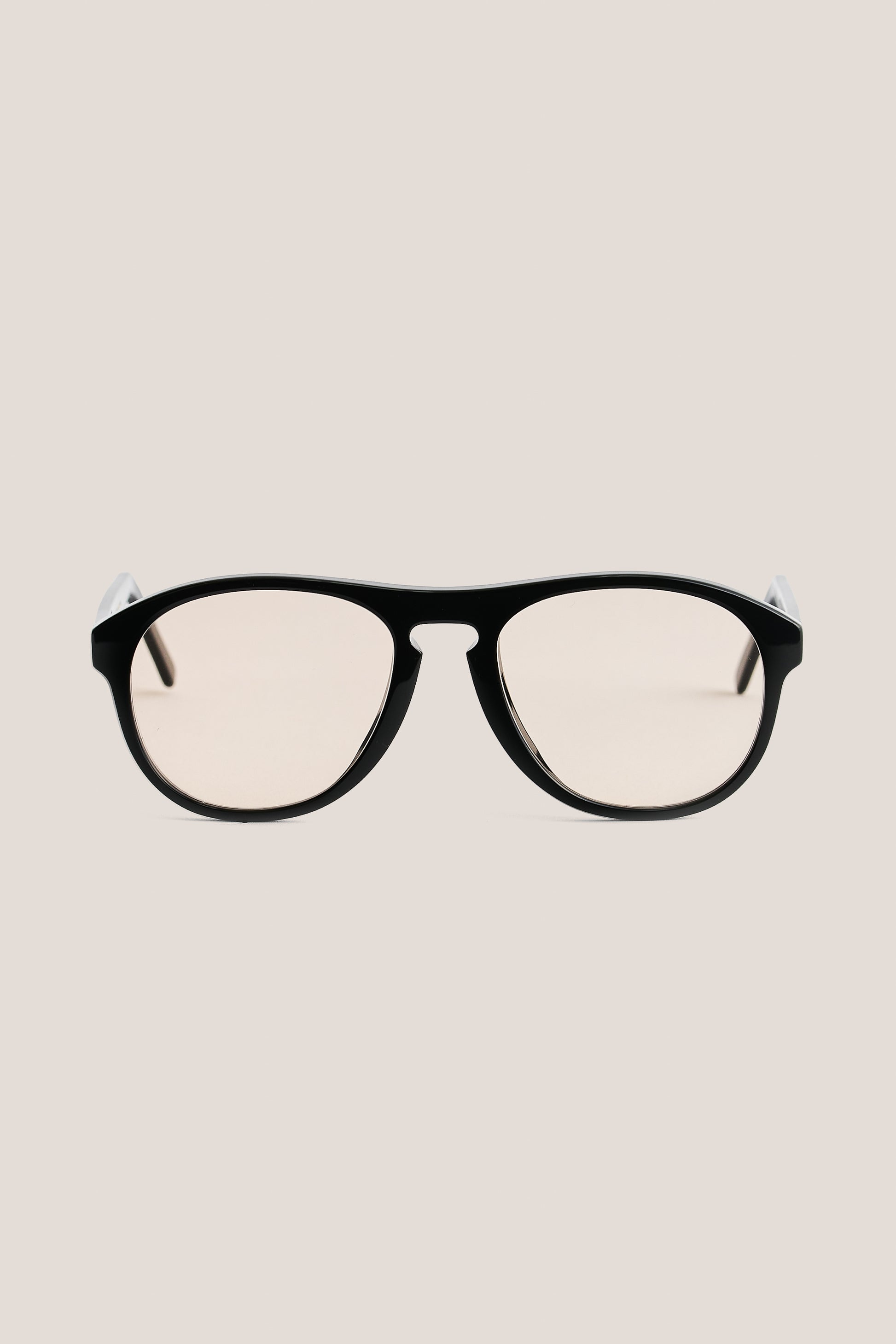 Unisex accessories sunglasses, black acetate aviator shape with rounded vintage-inspired edges and light lenses.