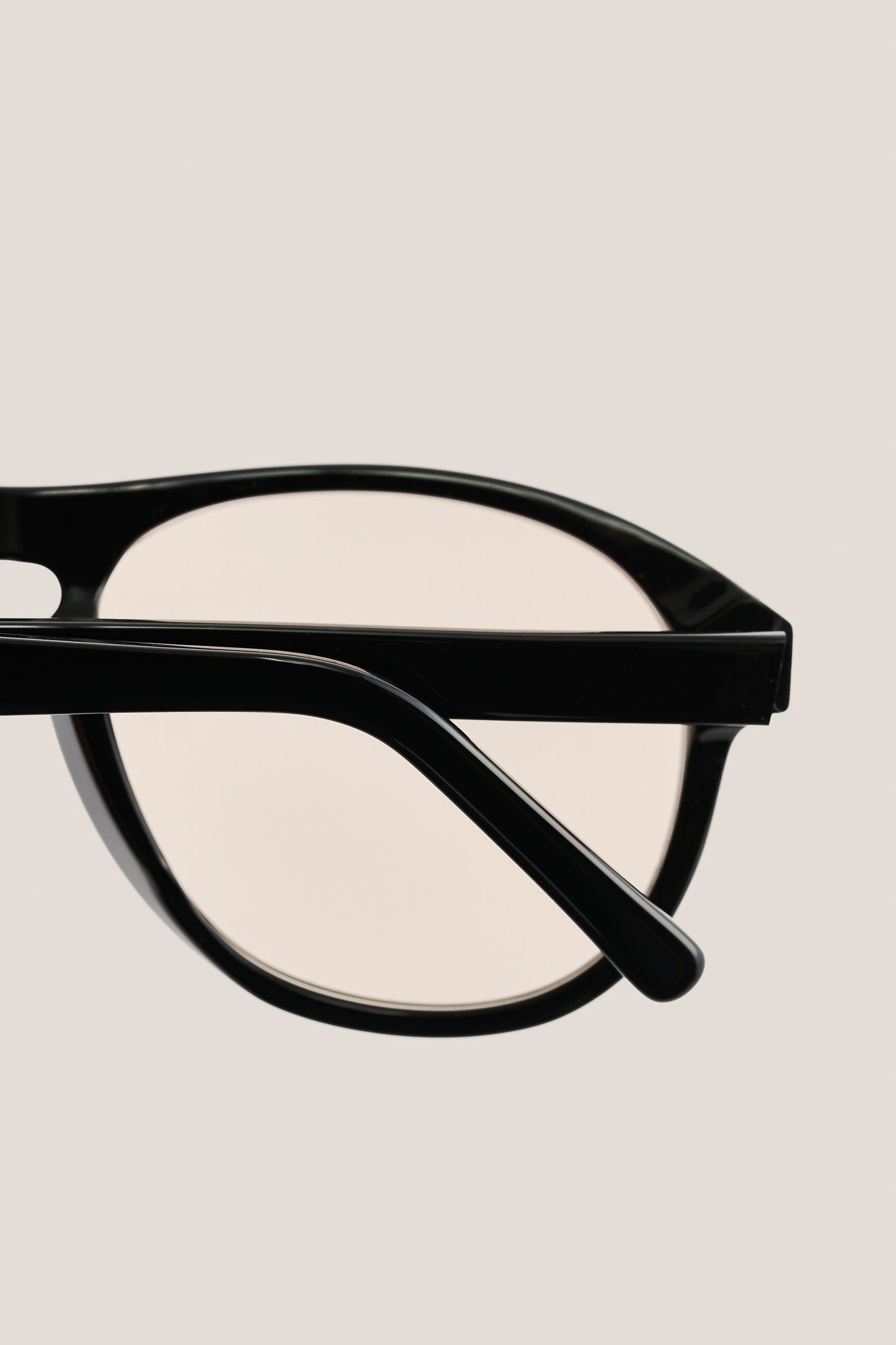 Unisex accessories sunglasses, black acetate aviator frame with light lenses.