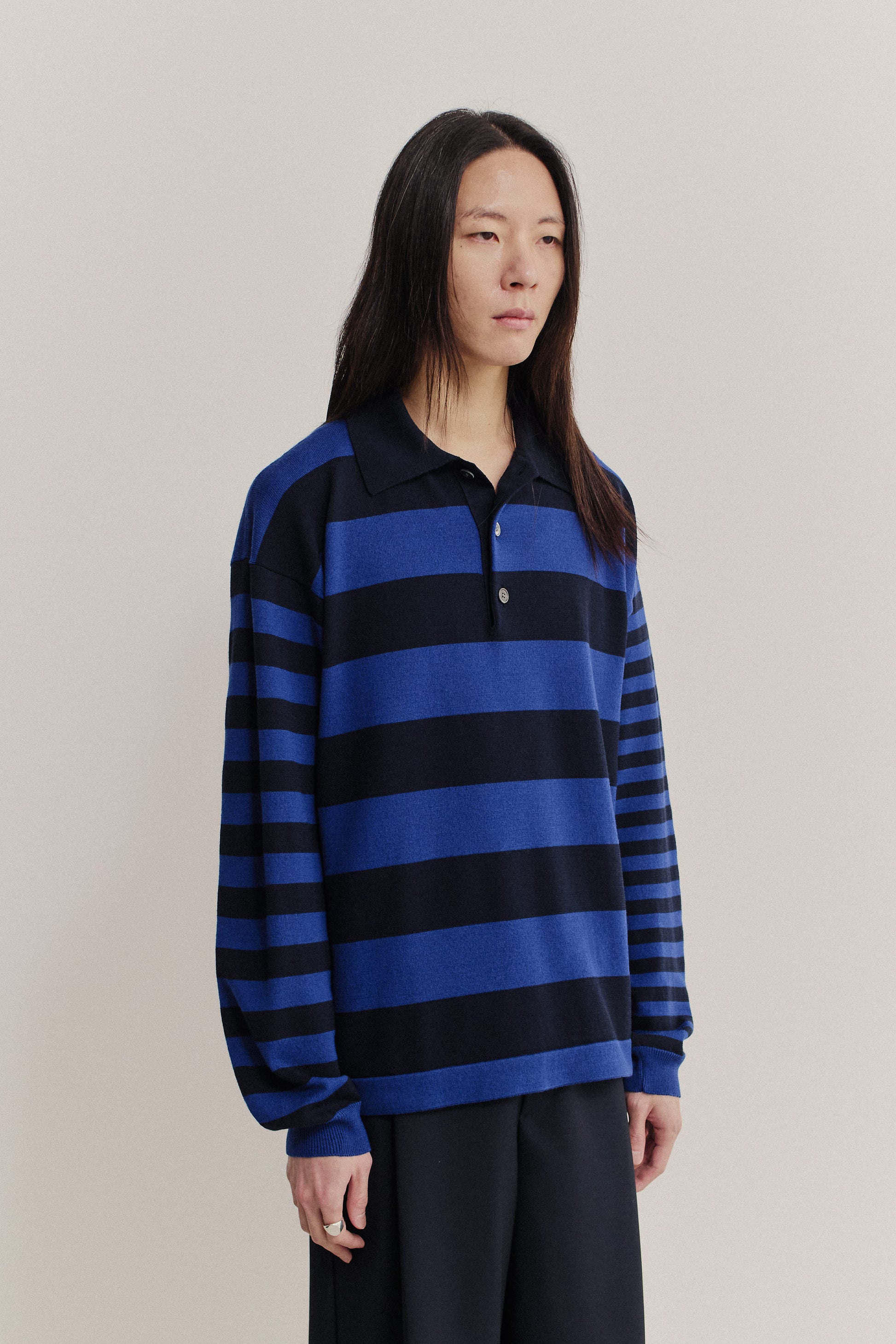 Men's knit long-sleeved polo shirt, 100% fine merino wool, blue and black horizontal stripes.