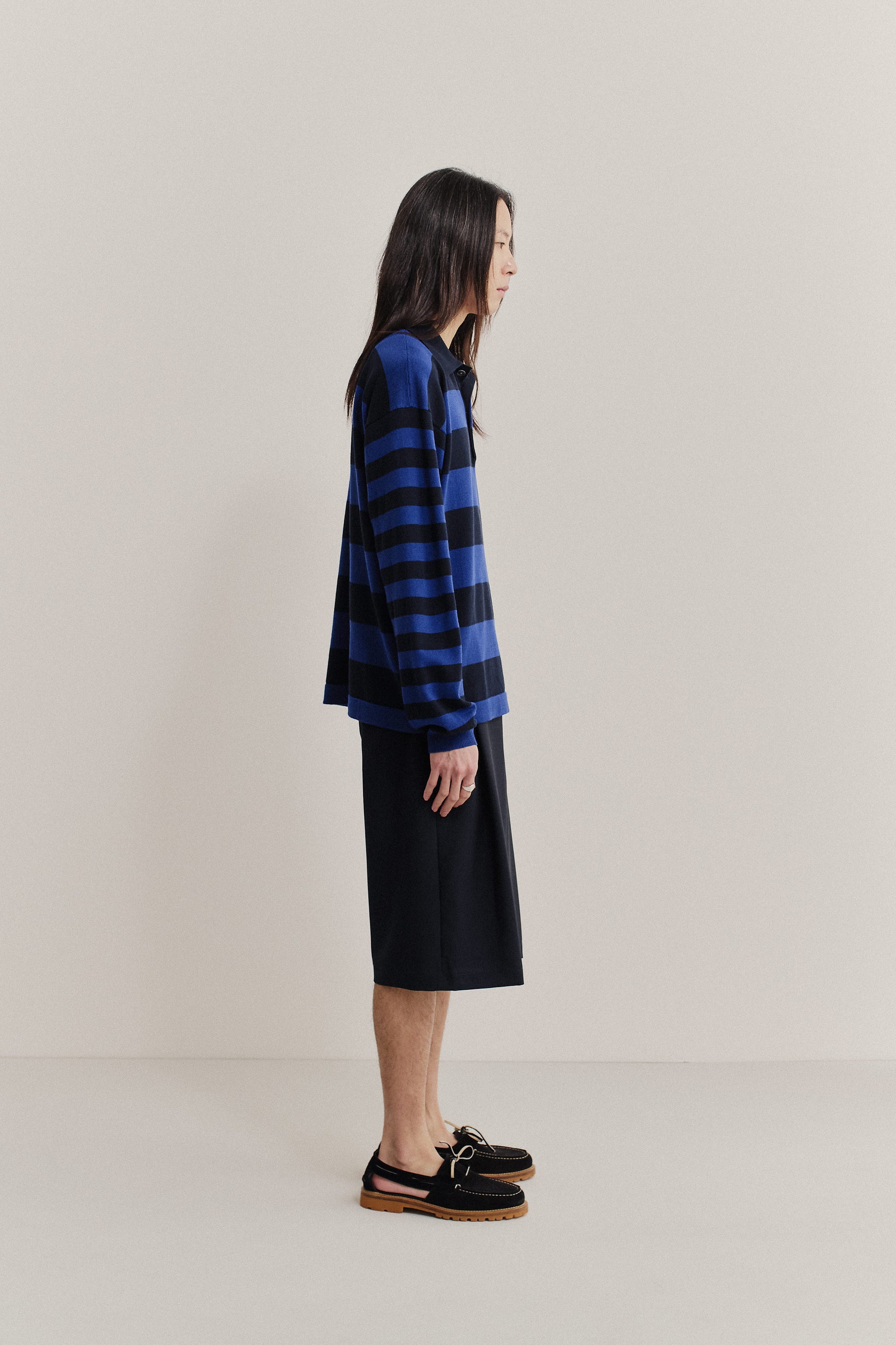 Men's knit long-sleeved polo shirt, 100% fine merino wool, blue and black striped.