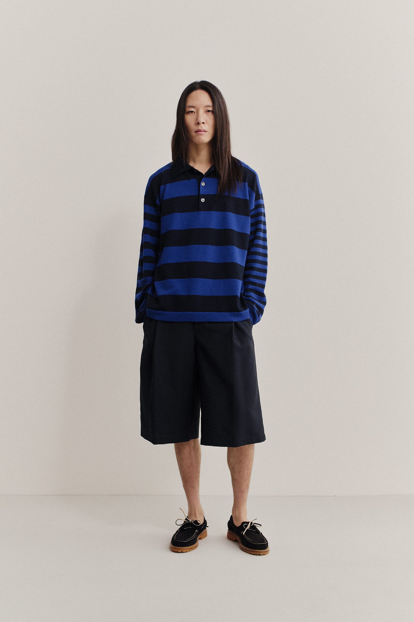 Men's knit long-sleeved polo shirt, 100% fine merino wool, blue and black striped.