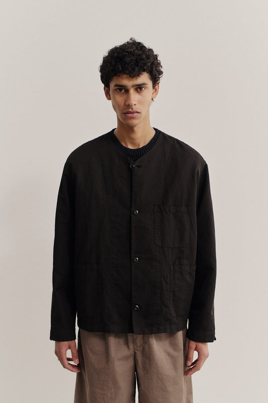 Men's long-sleeved overshirt, linen-cotton blend, garment-dyed deep black, with patch pockets and v-neck.