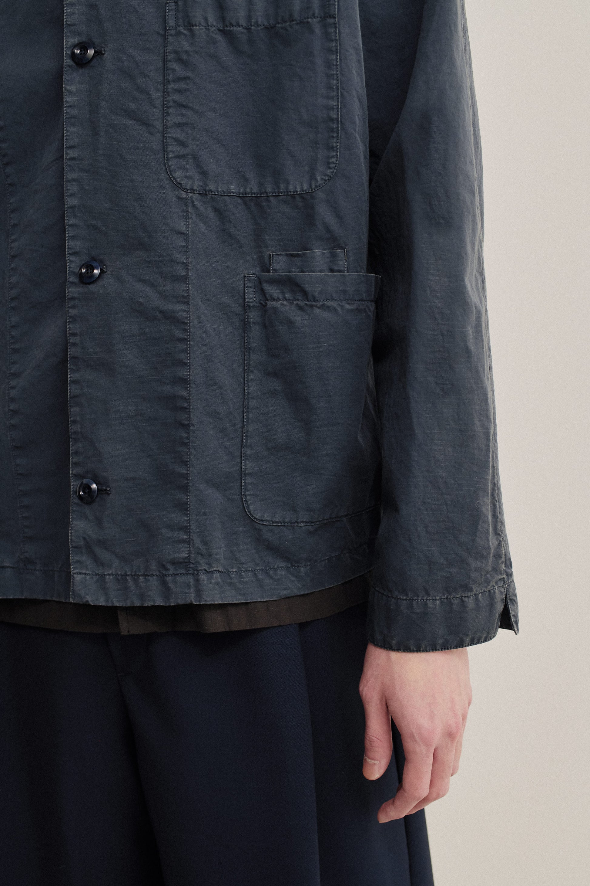 Men's outerwear overshirt, cotton-linen blend, garment dyed navy, with patch pockets and button closure.