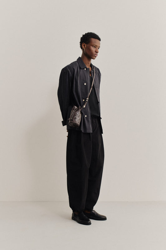 Men's long-pants, recycled nylon and cotton blend, black, relaxed fit, elastic waist, ankle length.