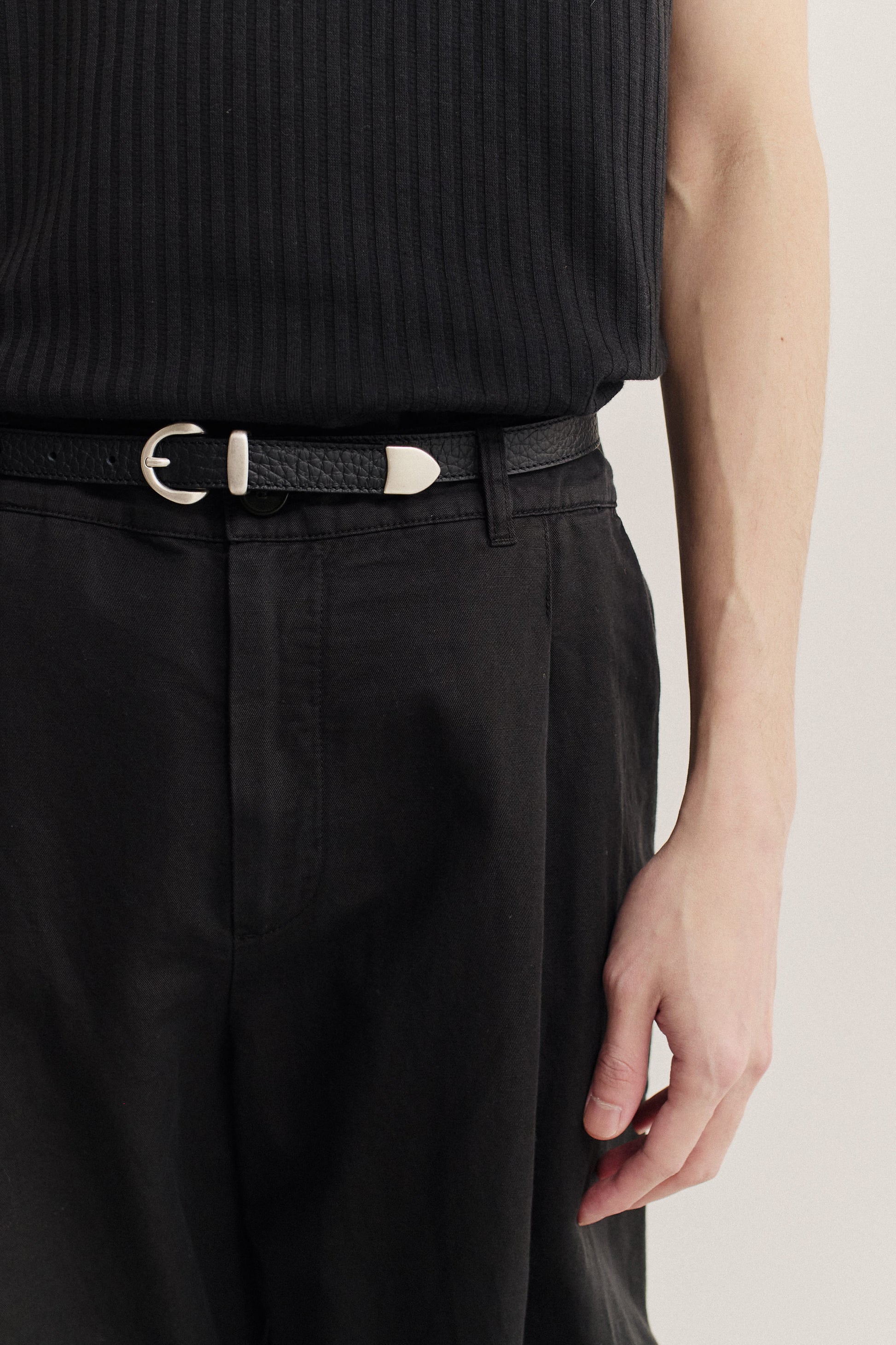 Men's accessories belt, black grainy calf leather with silver-tone buckle.