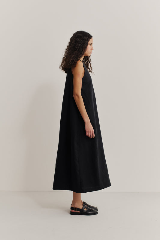 Women's dress, black worsted wool and linen blend, loose O-shaped silhouette, round front neckline, deep V-back.