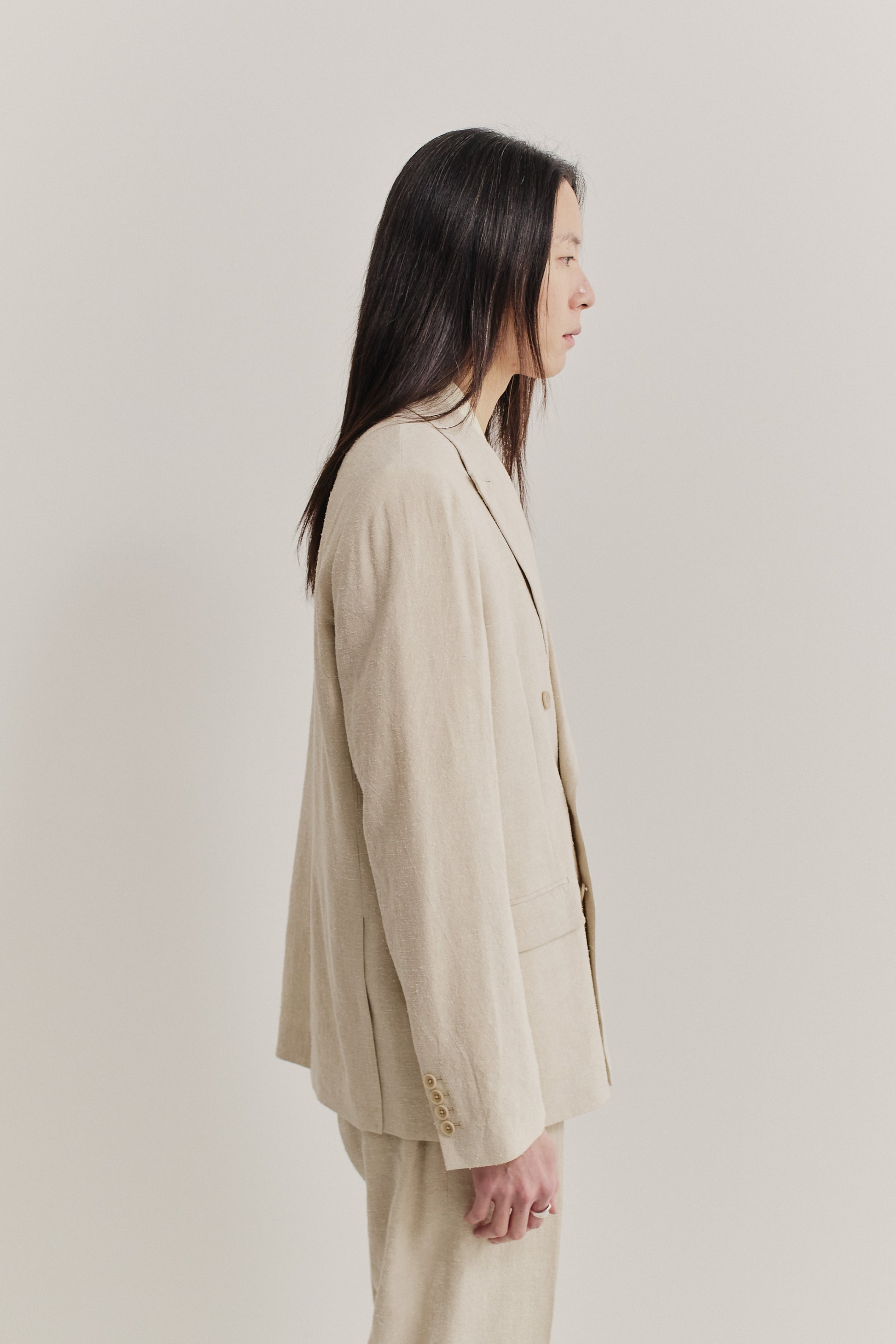 Women's tailoring, double-breasted peak blazer, linen-silk blend, naturally textured, undyed beige.