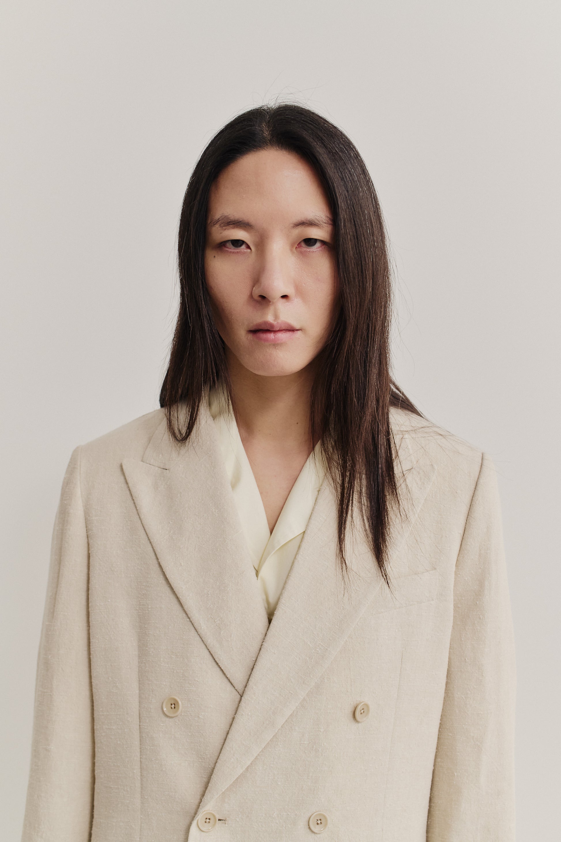 Men's tailoring, double-breasted blazer, linen-silk blend, naturally textured, undyed beige.