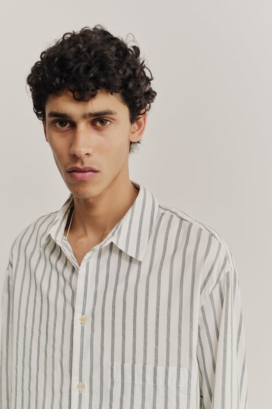 Men's long-sleeved shirt, cotton-silk-linen blend, washed finish, white with subtle green stripes, oversized fit.