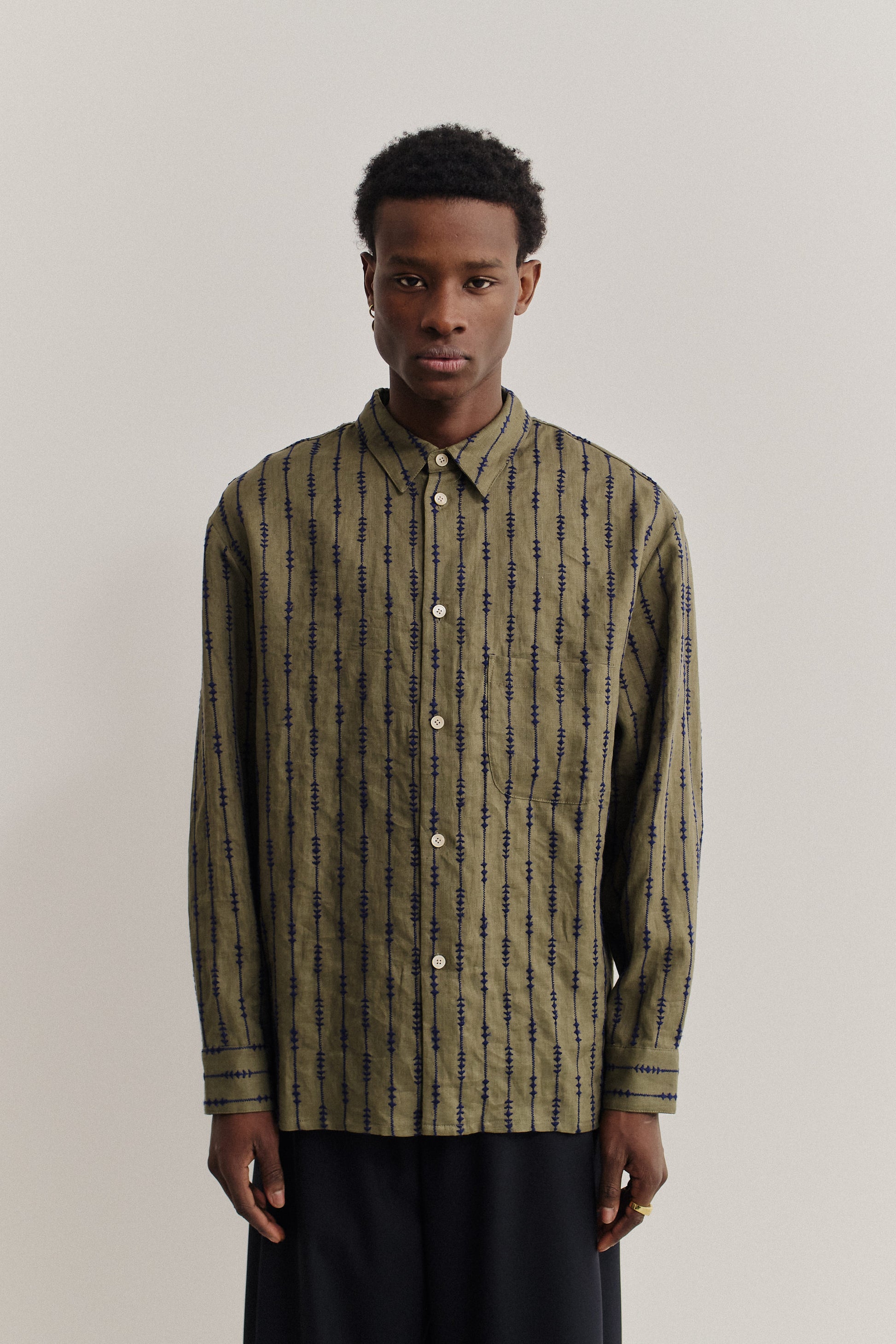 Men's long-sleeved shirt, linen, embroidered, olive green with dark blue vertical patterns.