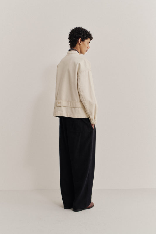 Men's outerwear jacket, organic cotton raw denim, off-white, boxy fit, stand-up collar, back strap.