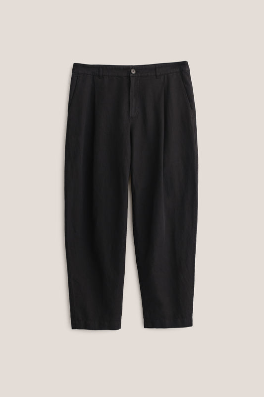 Men's long-pants, linen and cotton blend, garment-dyed black, with single front pleat and cropped tapered leg.