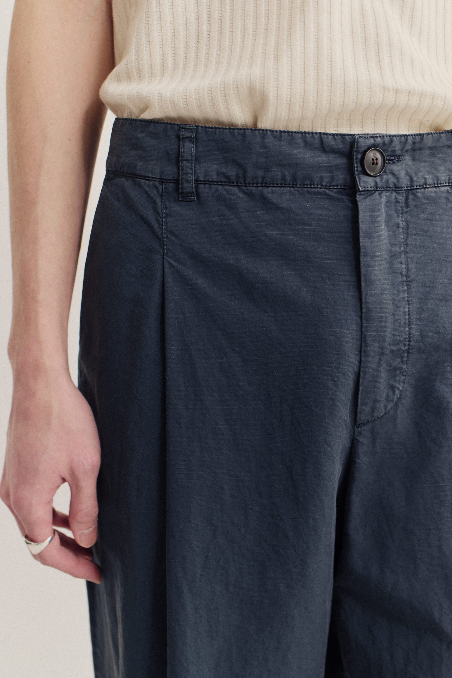Men's long-pants, cotton-linen blend, garment dyed navy, with single front pleat and belt loops.