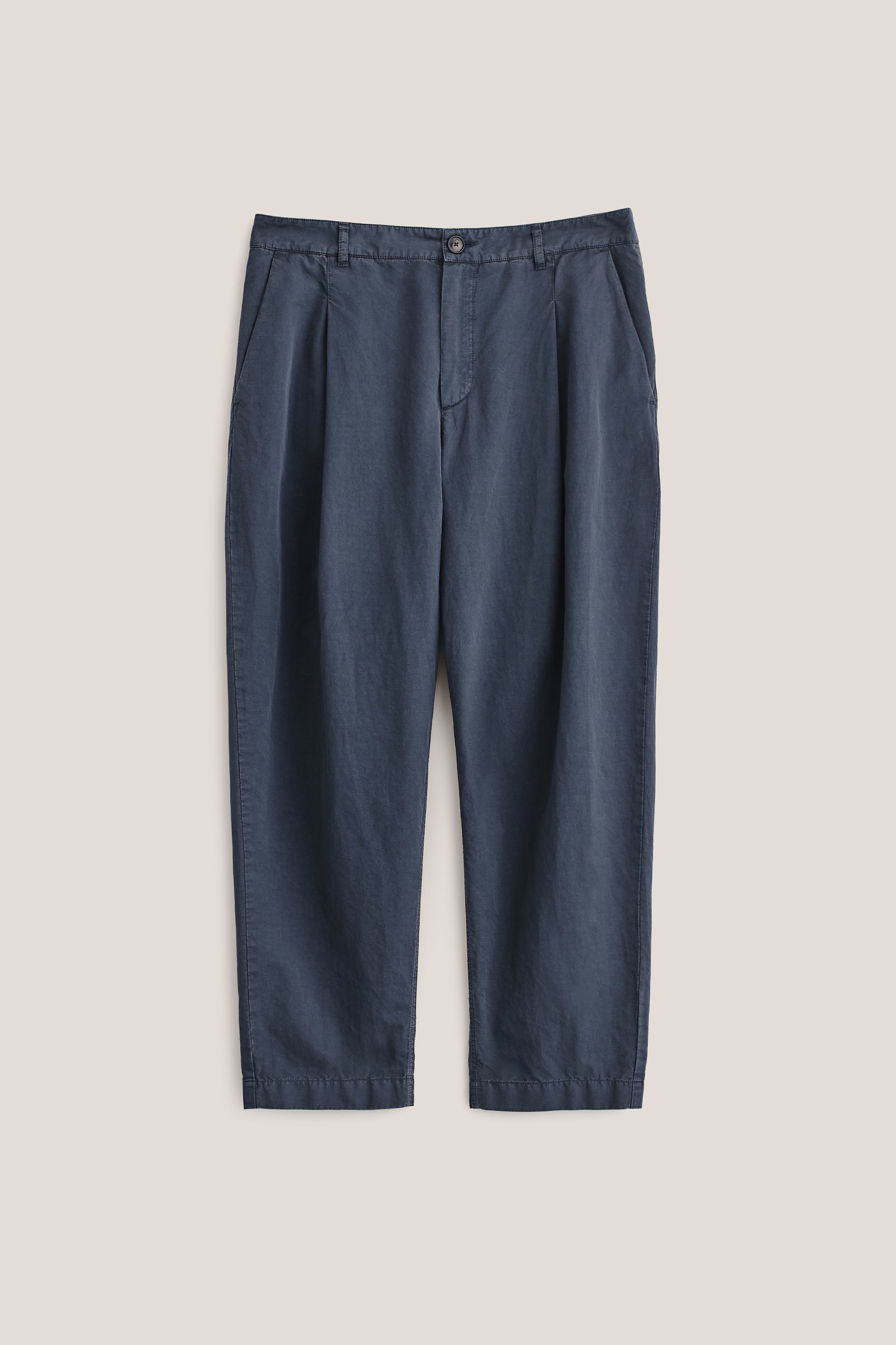 Men's long-pants, cotton-linen blend, garment dyed navy, with single front pleats and cropped tapered leg.