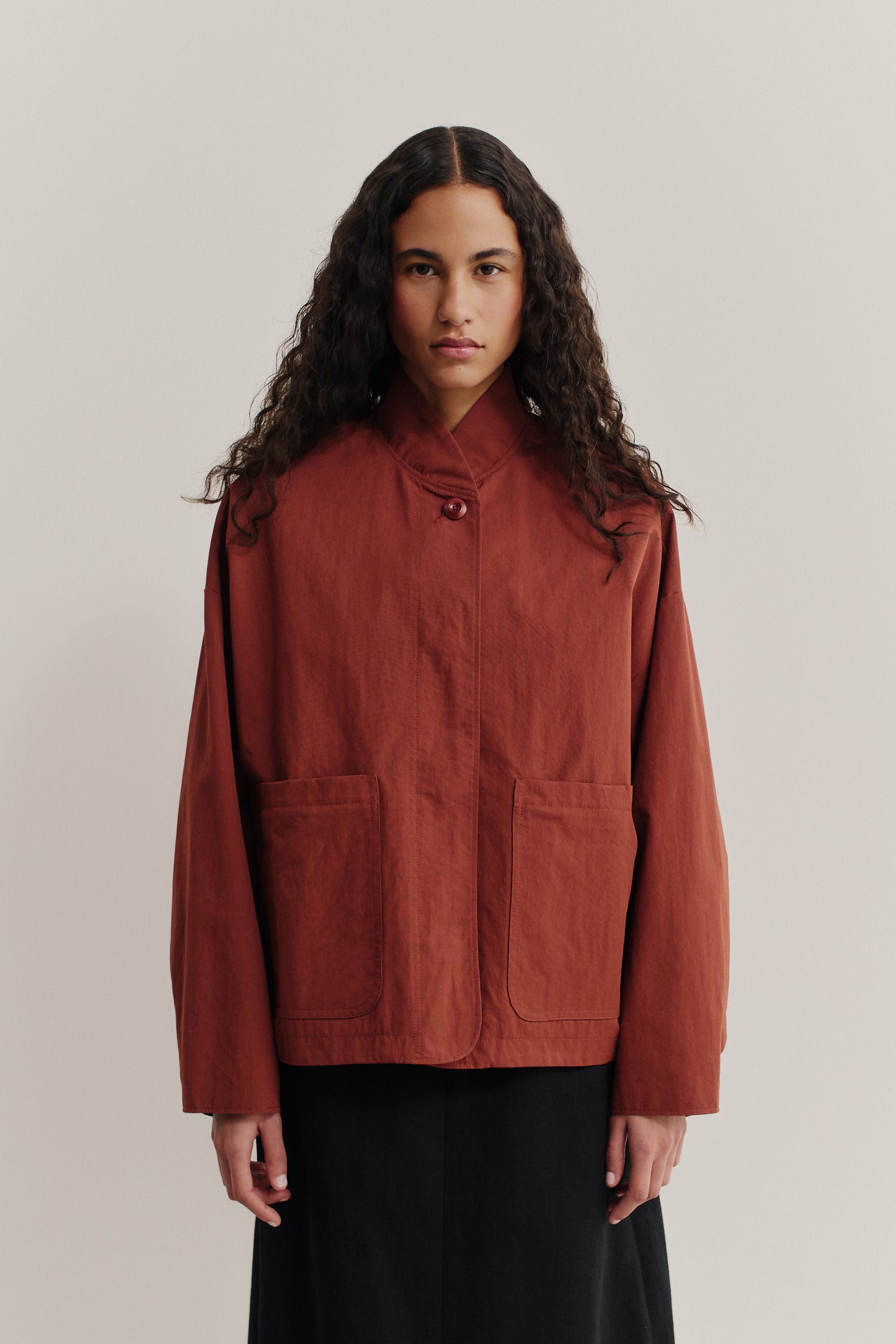 Women's outerwear jacket, water-repellent cotton blend, terracotta, with stand collar and patch pockets.