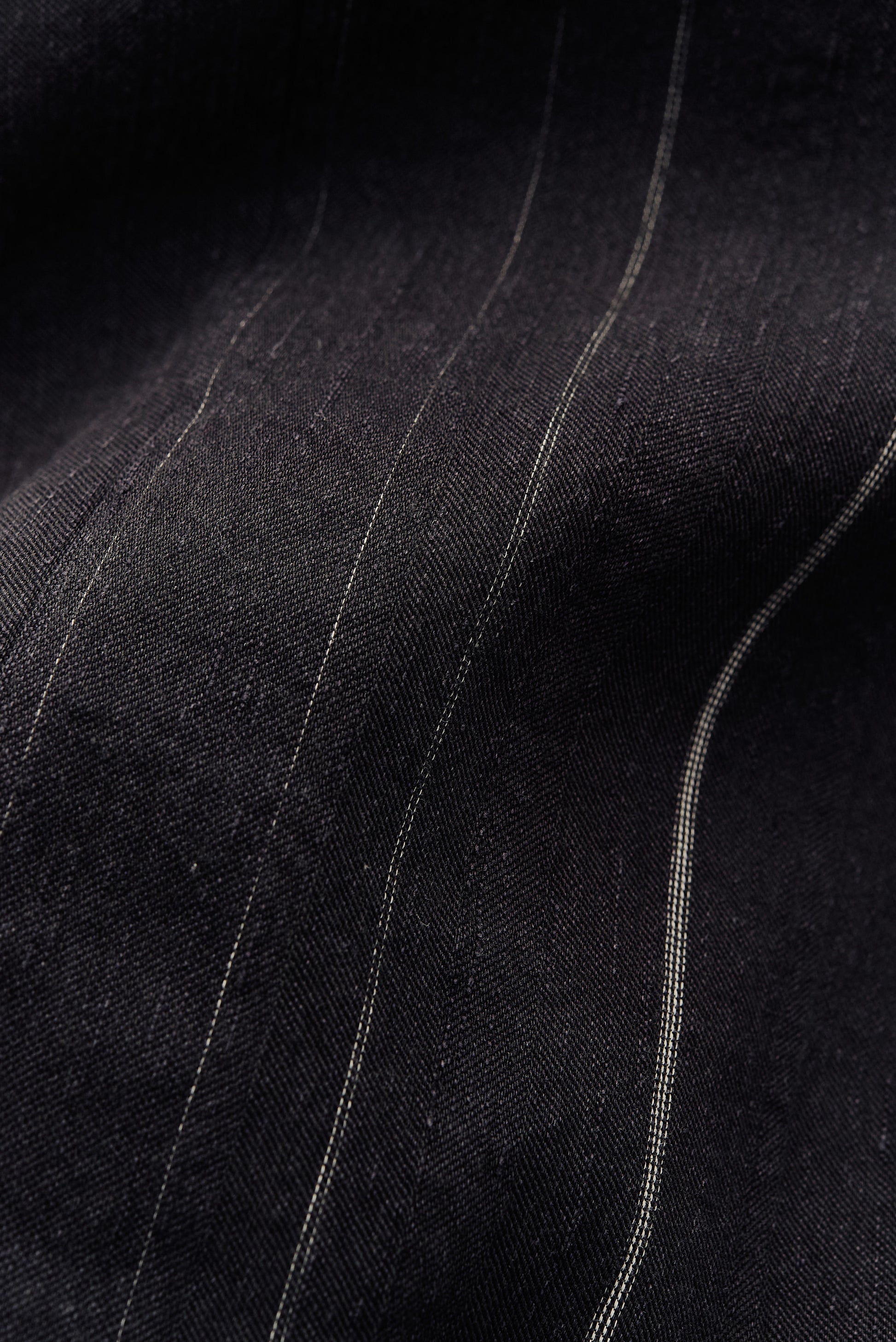 Men's long-sleeved overshirt, black cotton-linen blend with subtle white pinstripes.
