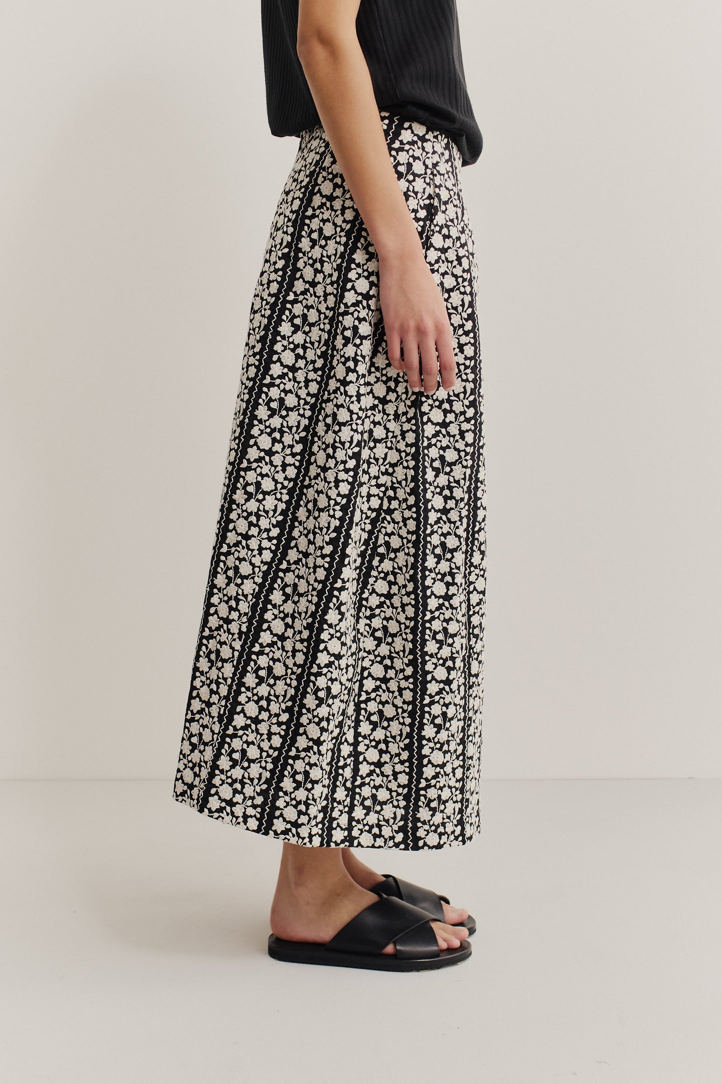 Women's skirt, midi, cotton, black with white embroidered floral blocks, o-shaped fit, side pockets.