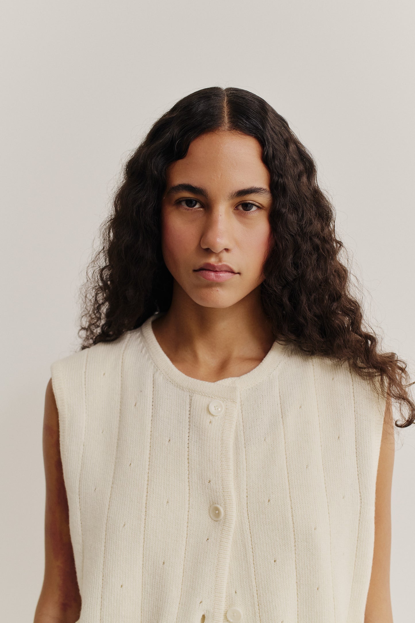 Women's knit vest, 100% merino wool, ajour knit, off-white, with button front.